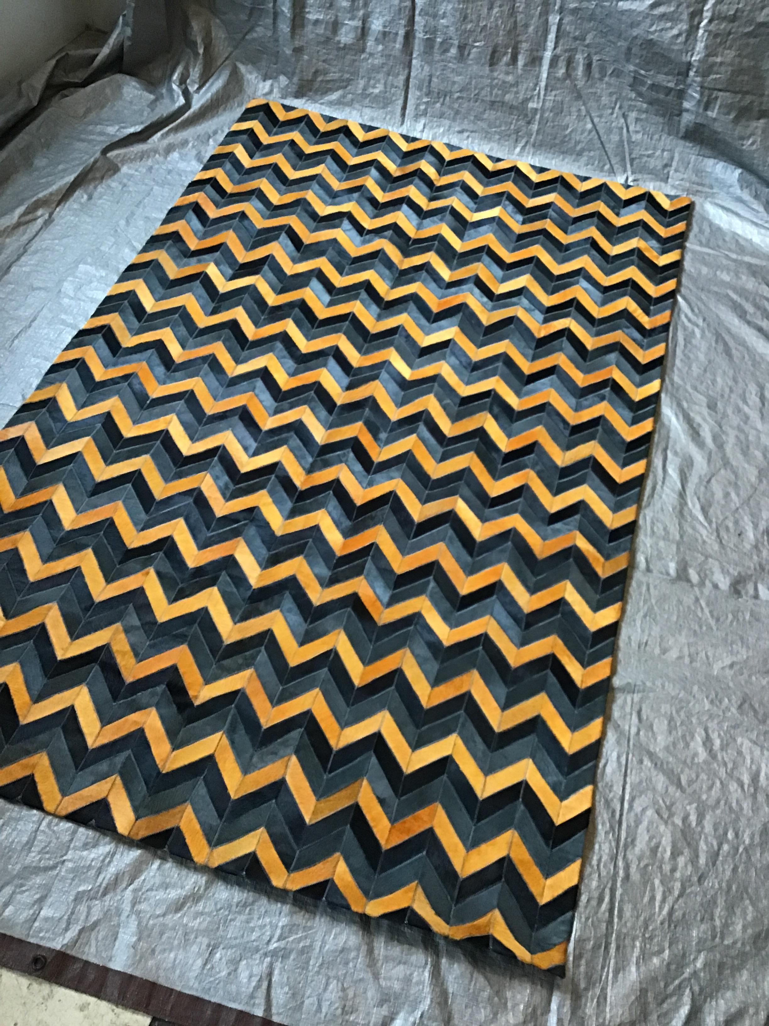 Castelluxe custom made goldenrod, black, grey, hair on hide rug. Measures: 5 x 8. Never used.