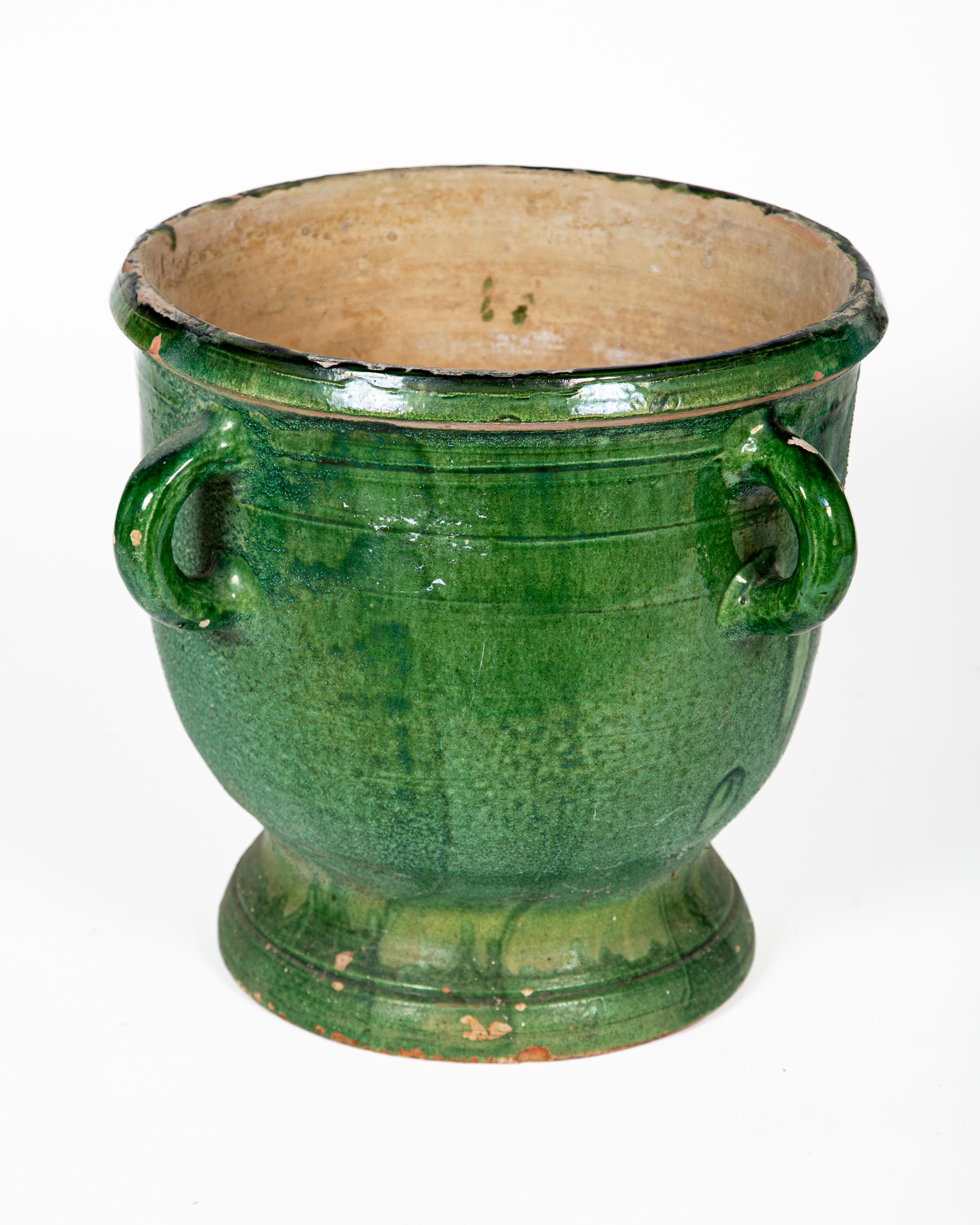 Castelnaudary Green Glazed Terracotta Jardiniere, circa 1900. Traditional four handle pot with rich, green glaze. The town of Castelnaudary is celebrated for this type of pottery.