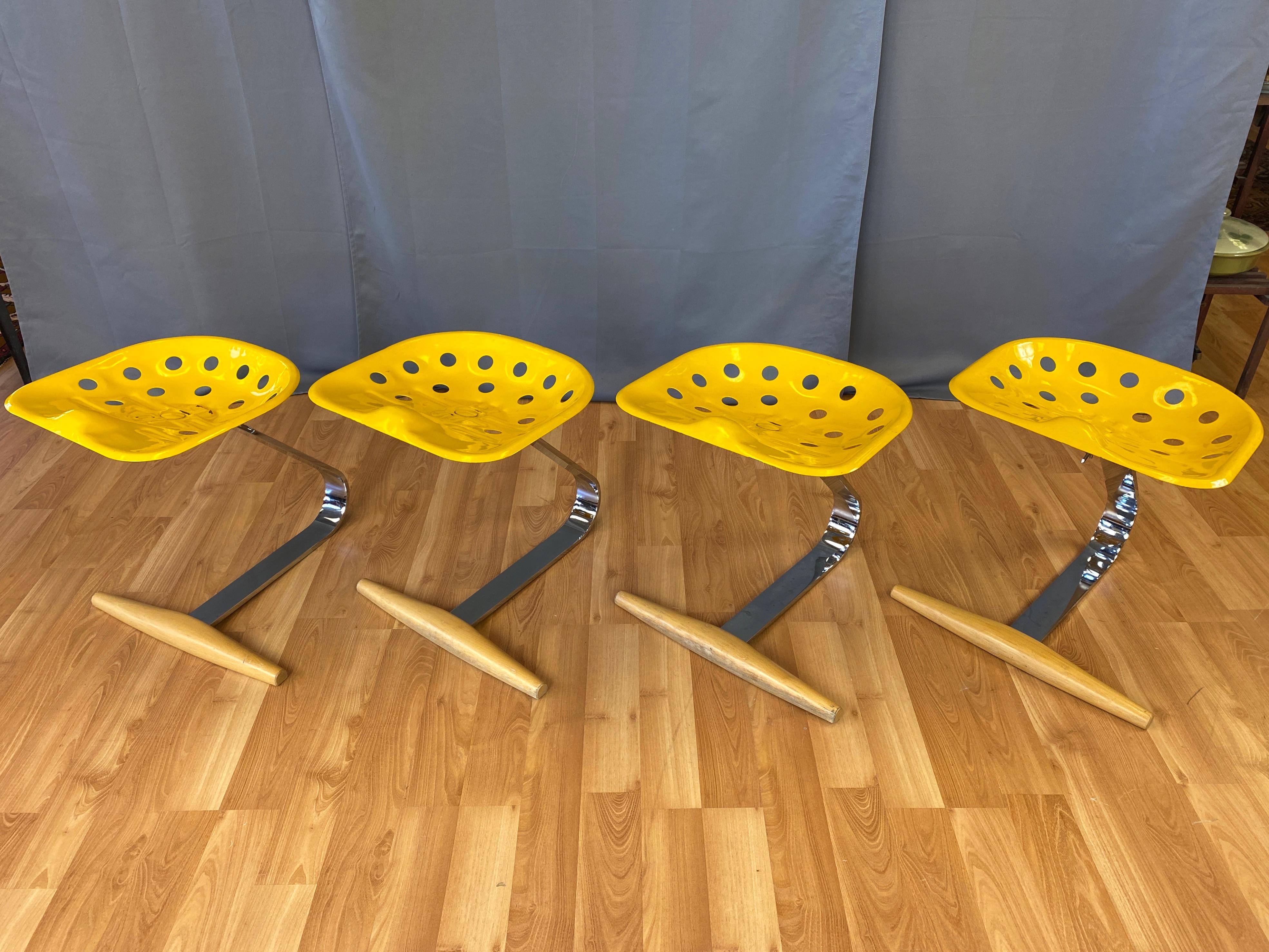 Two 1990s yellow Mezzadro stools designed in 1957 by Achille & Pier Giacomo Castiglioni for Zanotta. Offered individually, and identified from left to right in photos as ‘A’, ‘B’, ‘C’, and ‘D’, with ‘A’ and 