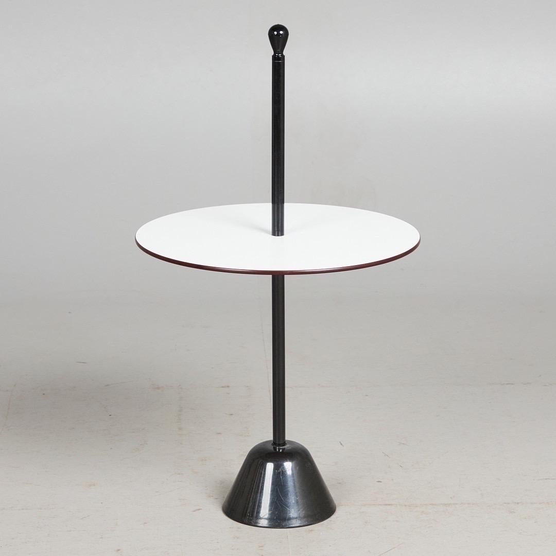 Achille & Pier Giacomo Castiglioni for Zanotta, side table/table, 'Servomuto' model, plastic, steel, designed in 1974, Italy. Side table with a frame made of black lacquered steel and a black and white, convertible table top made of plastic, with