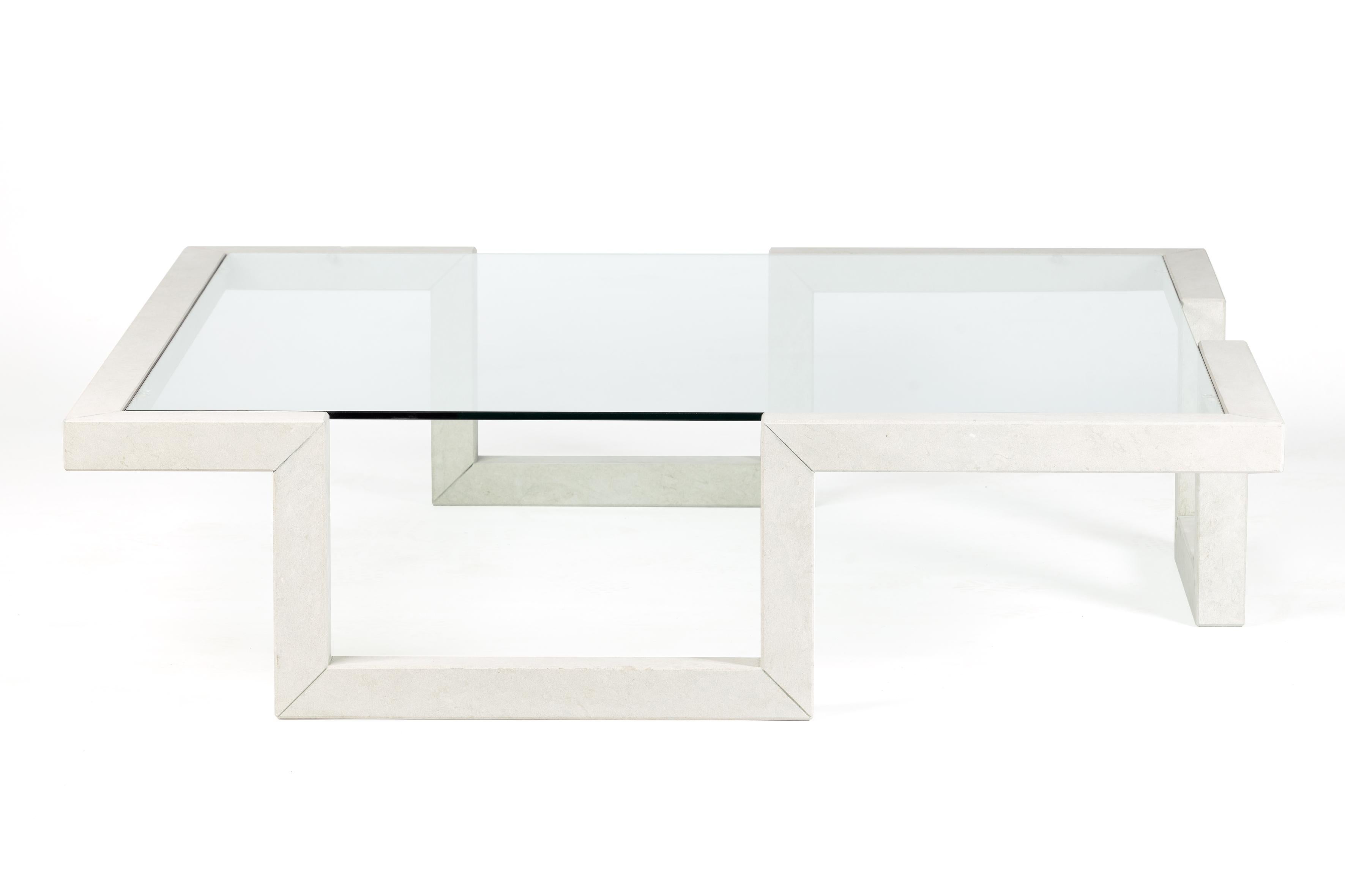 Castile is a marble coffee table with a linear and perfectly proportioned design. It consists of a fine structure of Bateig marble, a natural stone of Spanish origin, which runs through the space making square shapes. The table is supported by three