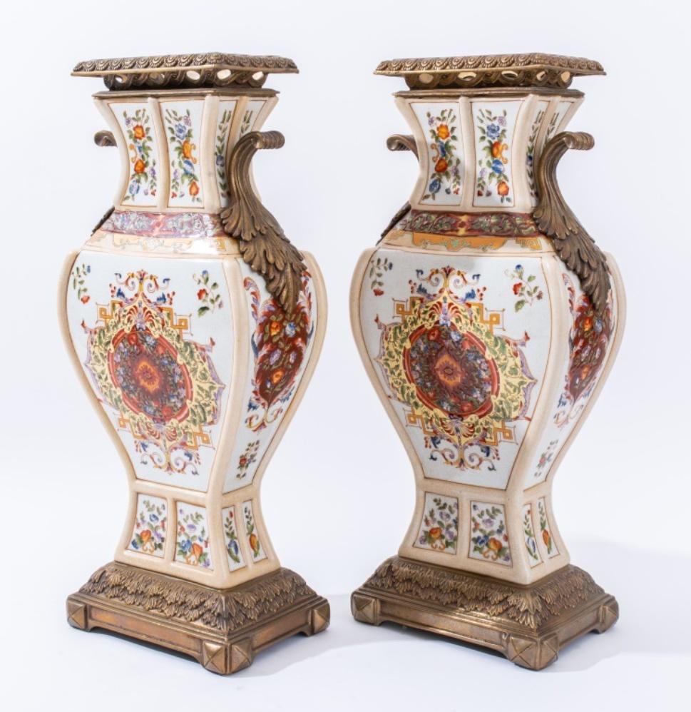 Pair of Castilian Chinese brass mounted porcelain tall vases with floral motif, each with maker's marks to underside.

Dimensions: 18