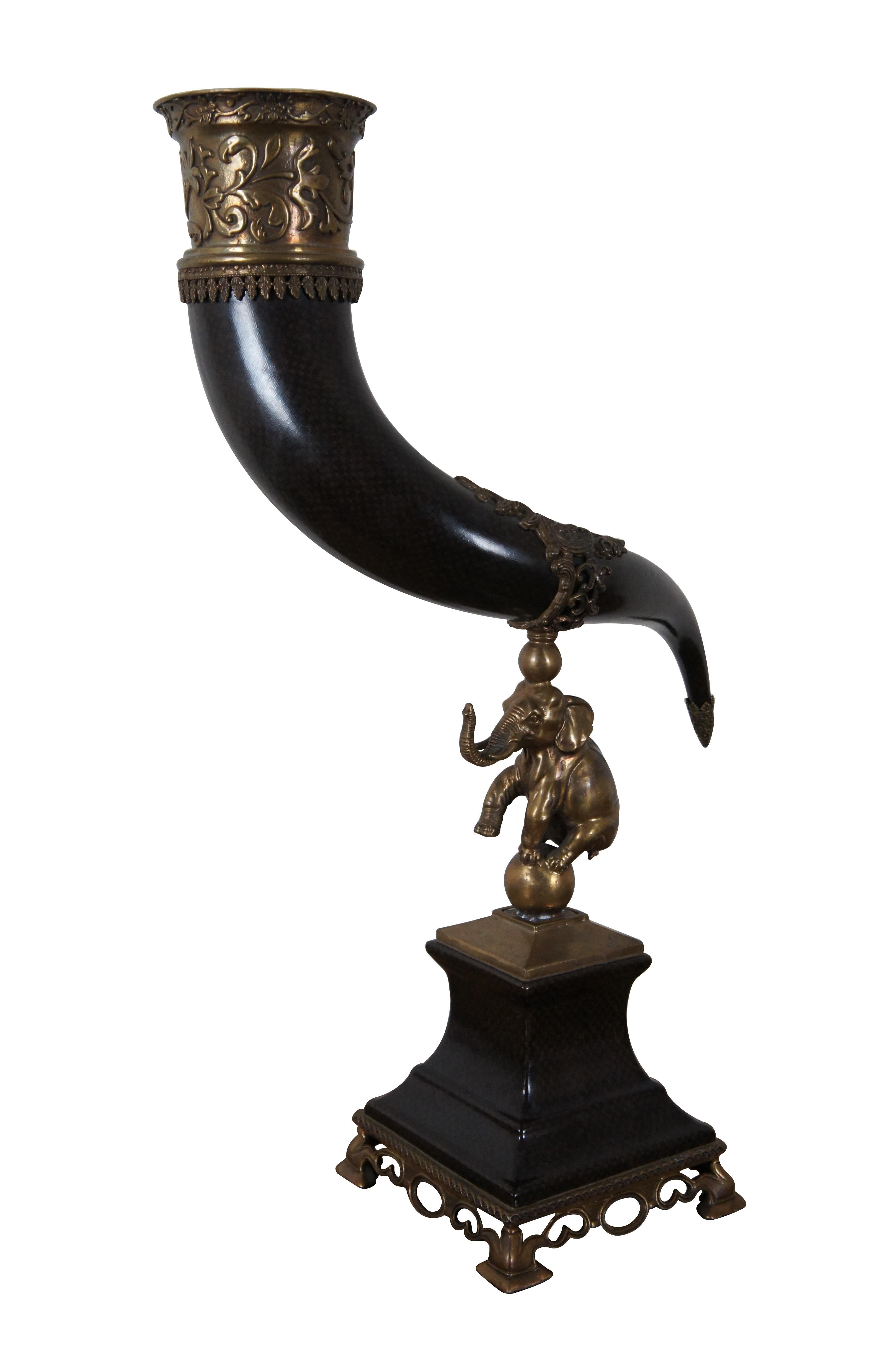 Ornamental hunt theme drinking horn / centerpiece trophy / cornucopia epergne / flower vase featuring a tapered pedestal base with brass capped feet and circus Elephant balancing a porcelain horn or tusk. Stamped on base, Item No. 4052-C4A. 