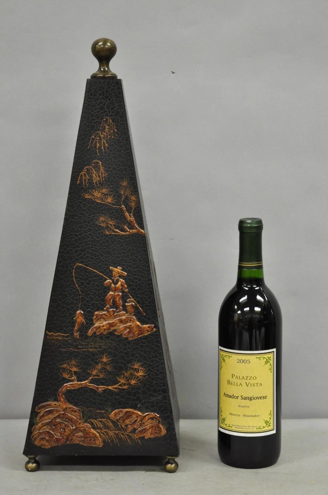 Castillian Imports Chinoiserie Black Lacquered Oriental Figural Painted Obelisk Pyramid with Brass Accents. Circa Late 20th Century. Measurements: 20
