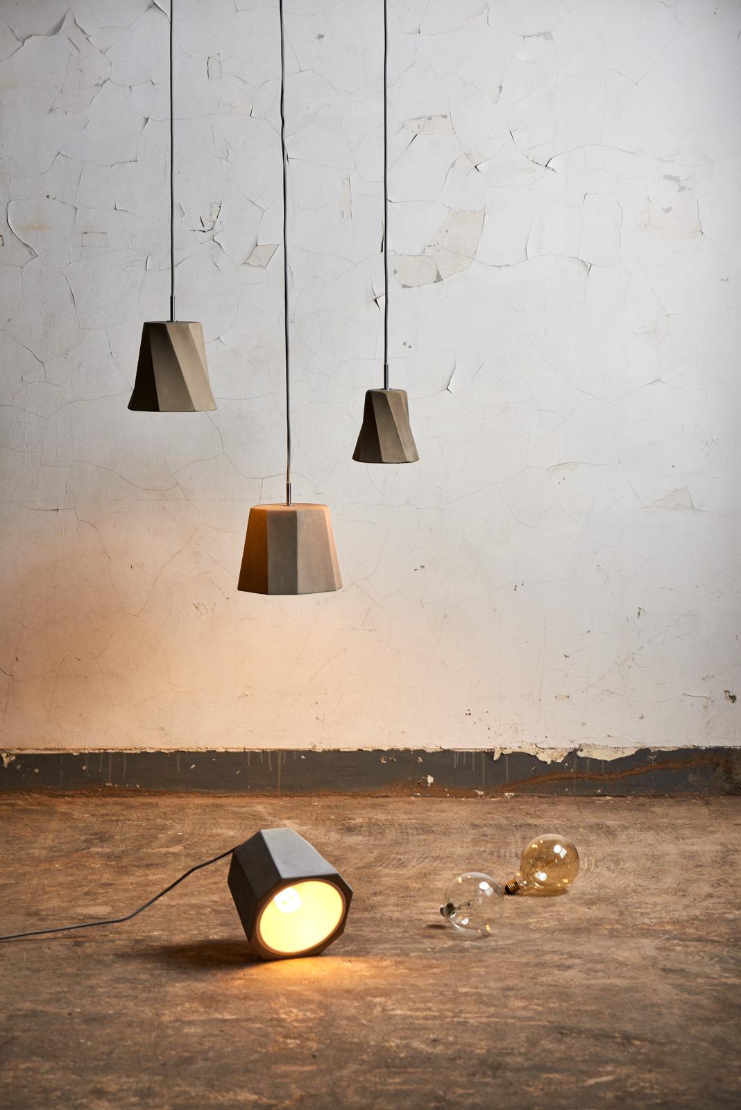 “One, two, three; one, two, three”
Inspired by the movement of a dancing women’s dress, the castle swing pendant propells a solid concrete shade to move. A simple twist in the shape gives an otherwise heavy material a lightness that evokes a sense