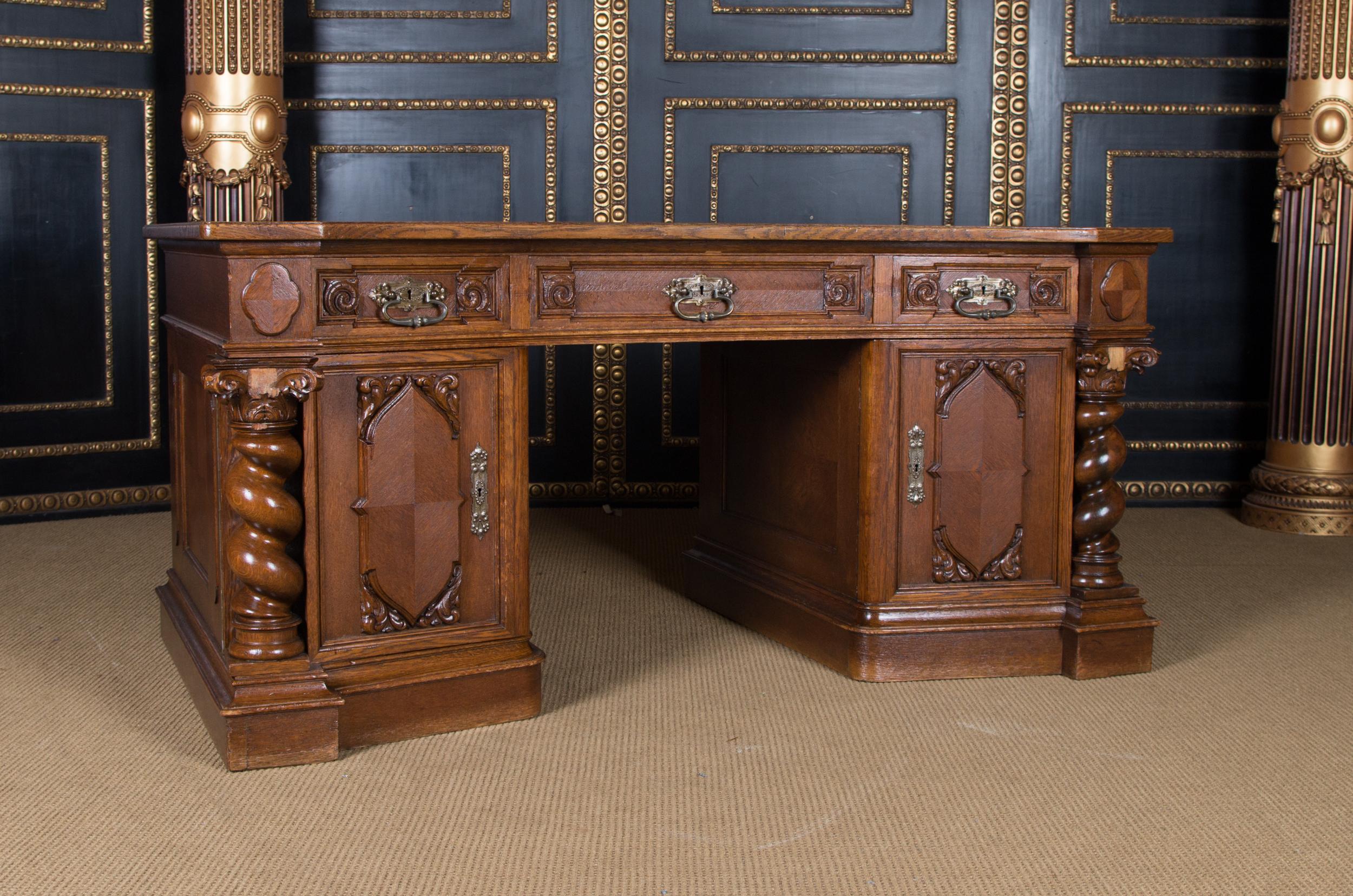 Castle worthy splendor desk Neo Renaissance circa 1860-1880 oak

Solid oak through and through. Straight body. Front high knee compartment with three different sized drawers. Two high doors with beautifully profiled panels flanked by spiral columns.