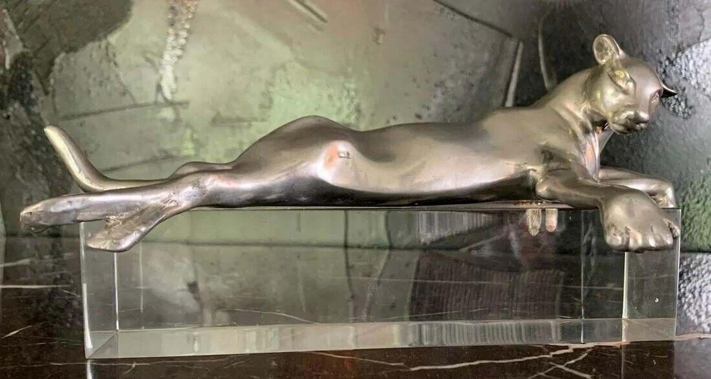 For your consideration is a gorgeous pewter lioness reclining on a lucite base. Signed by Caster Cooper on the verso. Dimensions: 10” x 4.5” x 4.5”
 