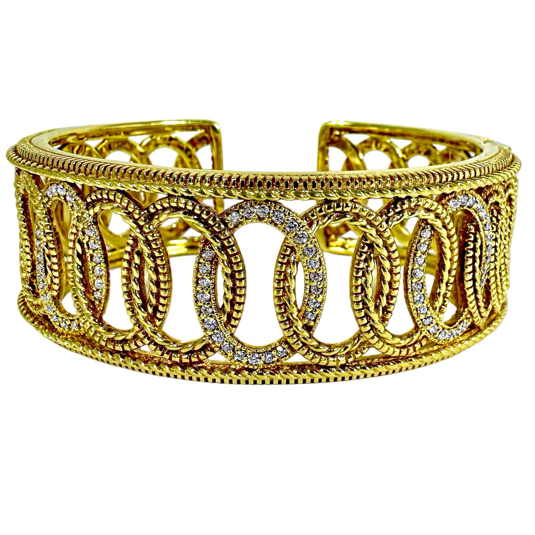 This wonderful Judith Ripka designer creation, created expertly from 18k yellow gold, is the personification of casual elegance. One continuous line of rope edged intertwined, oval motifs are flanked by edges that are in twisted rope and castellated