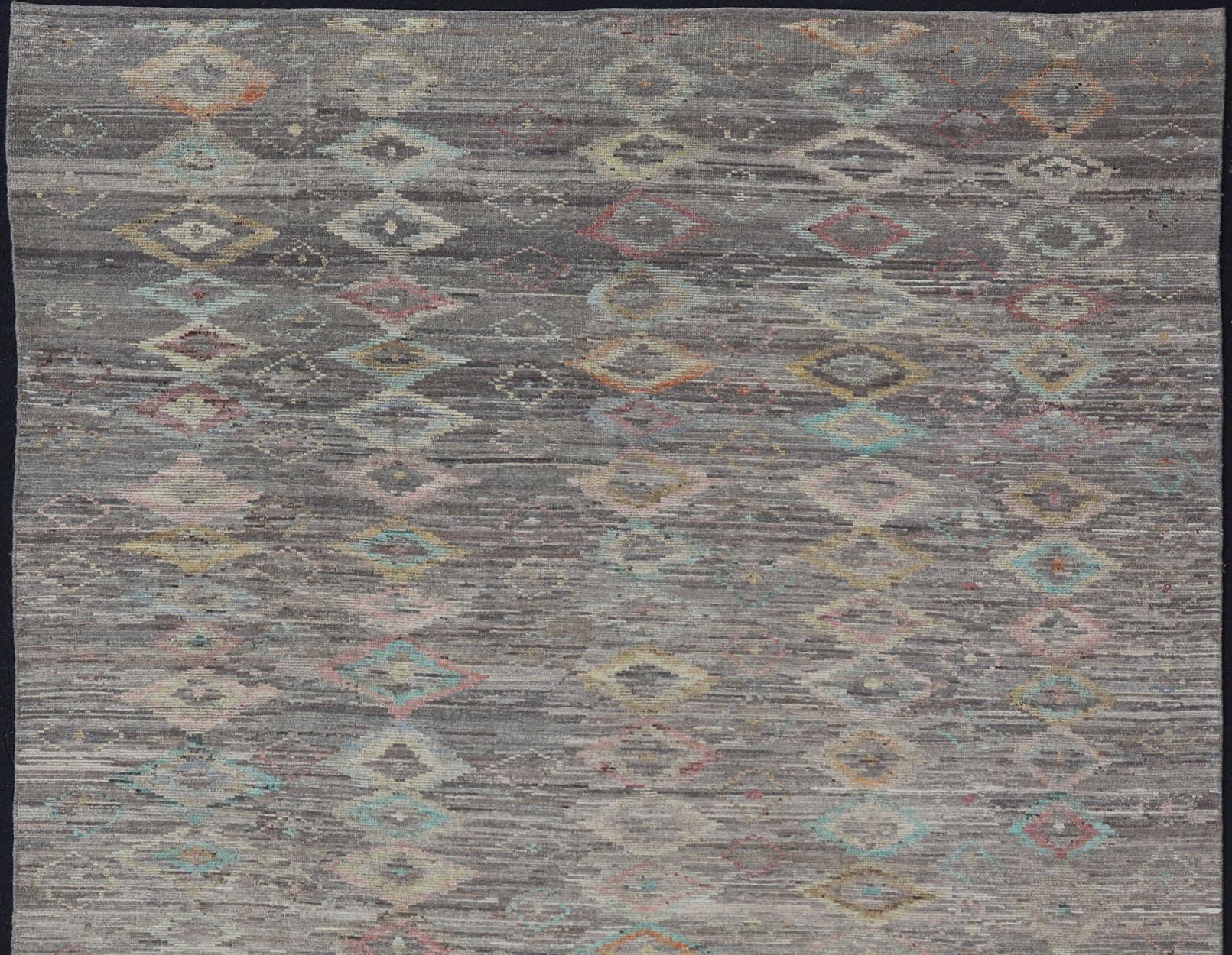 Casual modern design rug with faded pop of colors on a neutral and gray tone background, Keivan Woven Arts / rug AFG-36117, country of origin / type: Afghanistan / Moroccan tribal, modern casual.

The design of this piled rug makes it perfect for