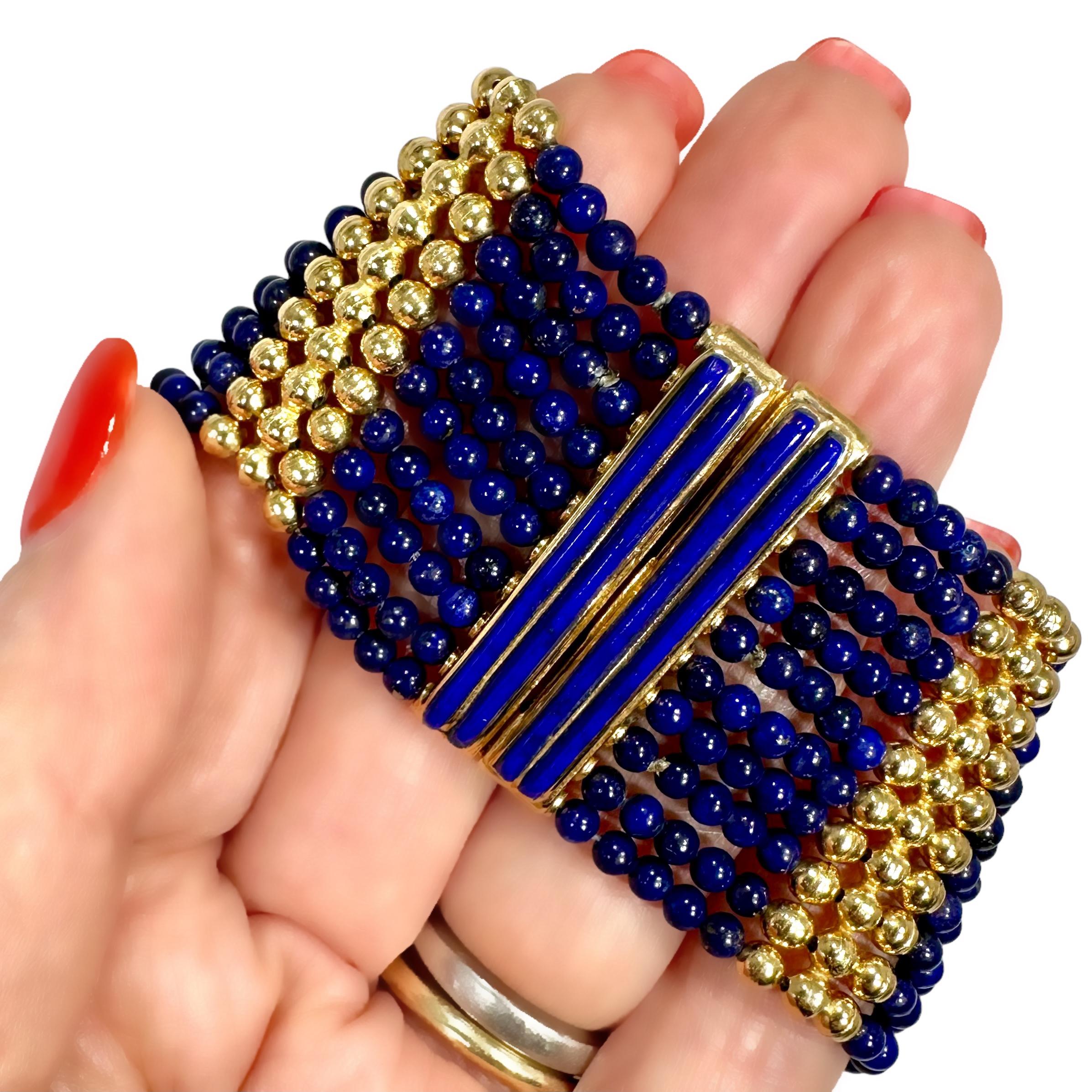 This is the perfect casual 18k yellow gold and lapis bead bracelet that works as well with jeans as it does with any tailored attire. Ten separate strands of luxurious blue 3mm lapis-lazuli beads are punctuated by seven three row 18K gold bead