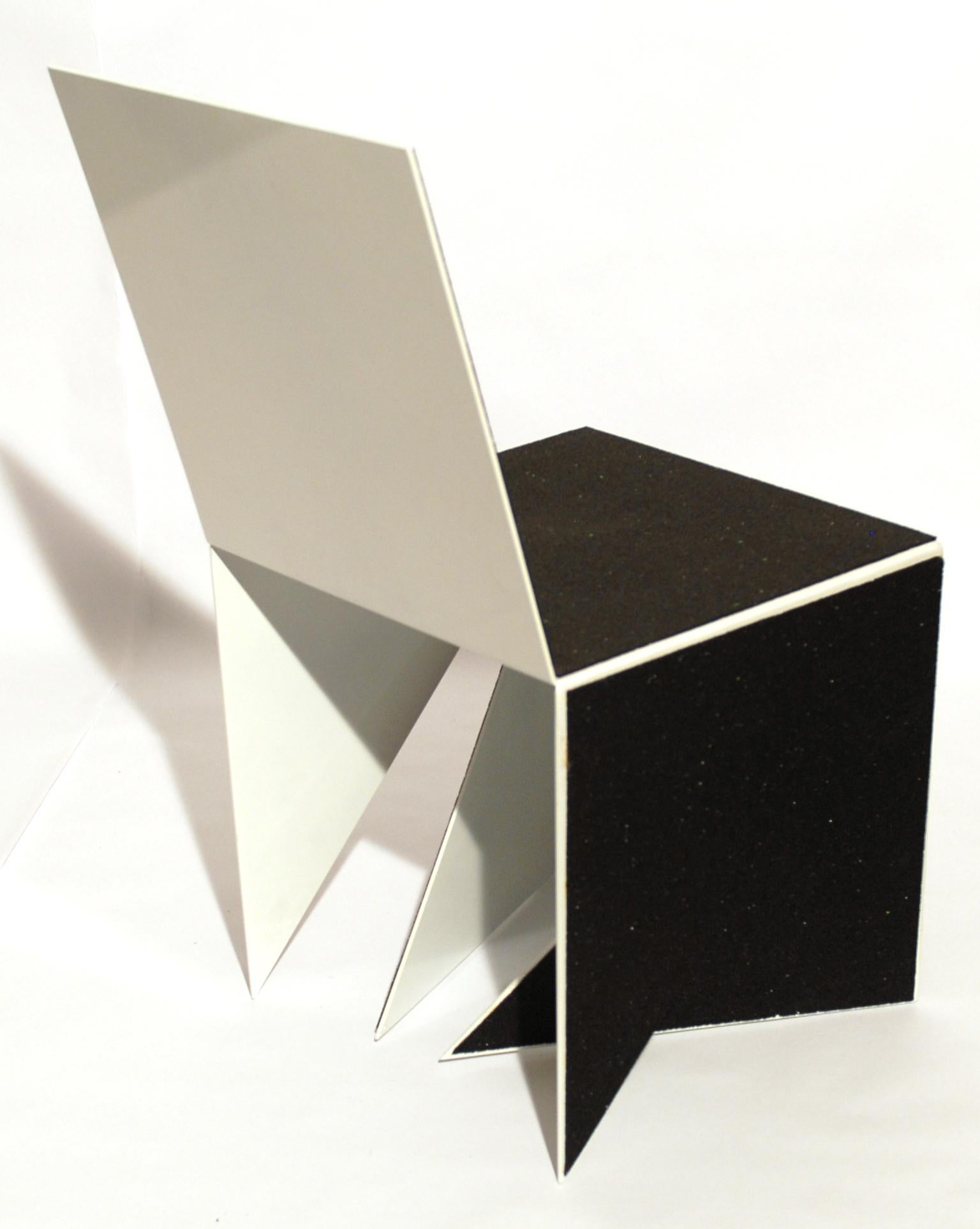 Casulo Cube #2 by Mameluca
Material: Electrostatic Aluminum paint, recycled rubber blanket.
Dimensions: D 45 x W 45 x H 90 cm
Also available in different dimensions.

Opening a cube and transforming it into a plan was the starting point for the