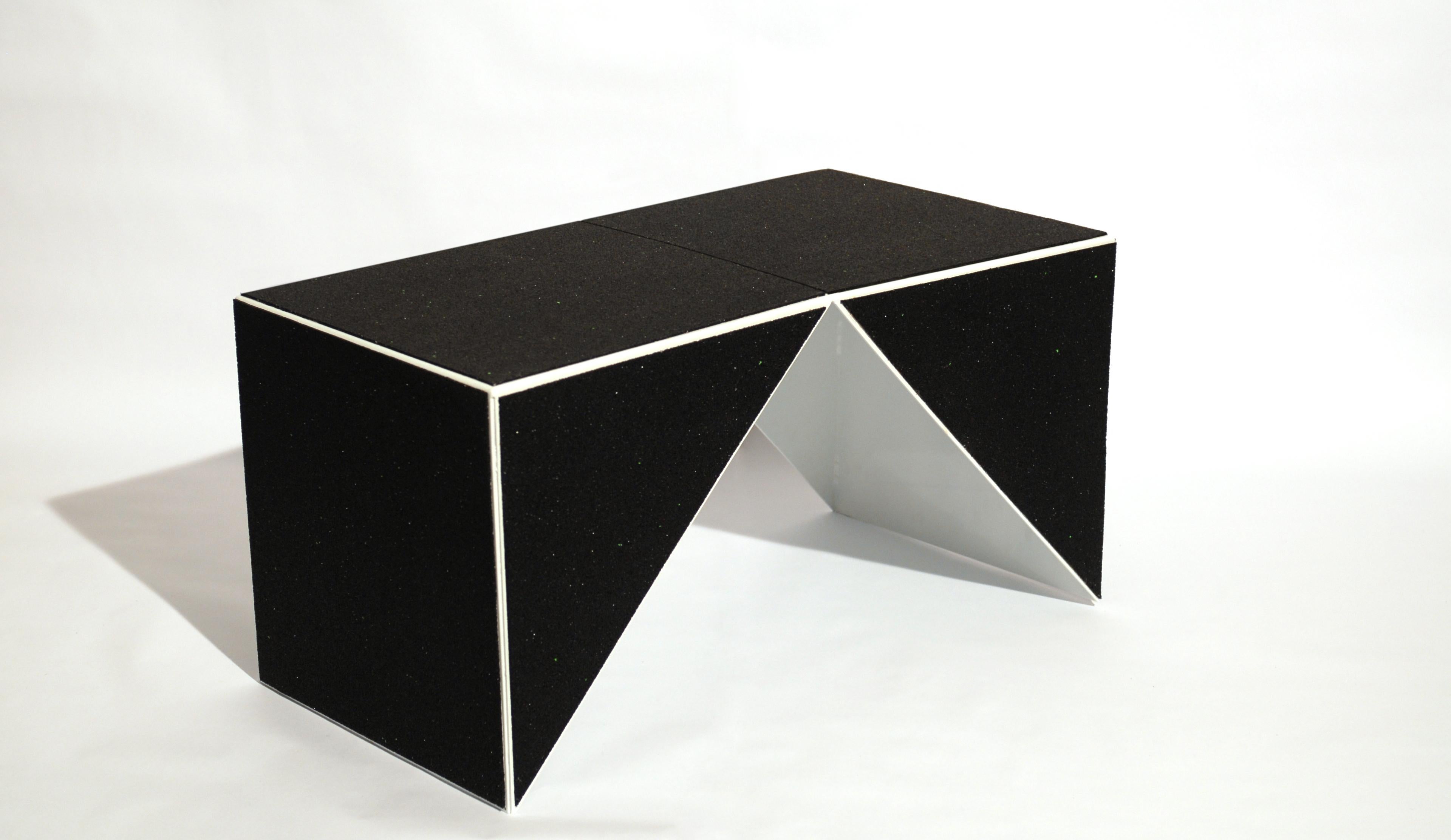 Casulo cube #3 by Mameluca
Material: Electrostatic Aluminum paint, recycled rubber blanket.
Dimensions: D45 x W90 x H45 cm
Also available in different dimensions.

Opening a cube and transforming it into a plan was the starting point for the