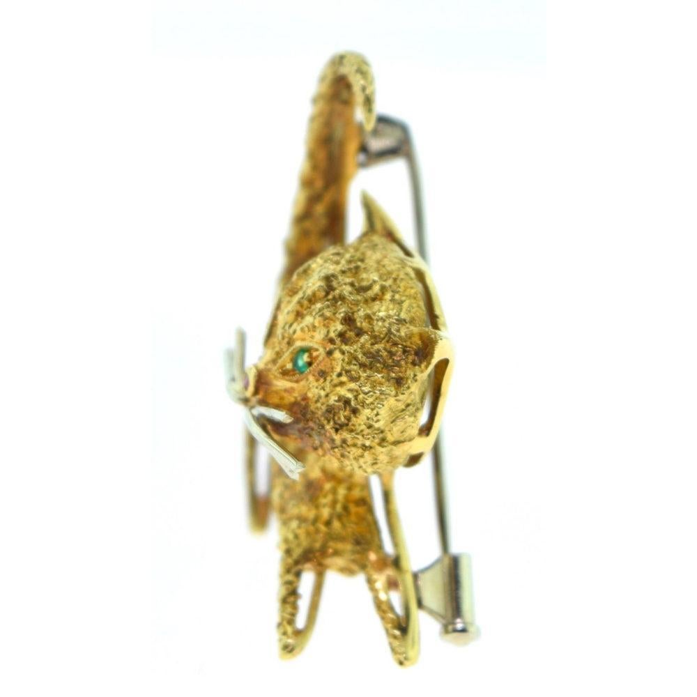 Details:

This is a PURRRR-fect gift for any occasion - whether sophisticated or casual.

ITEM SPECIFICATION:
- Metal: Yellow Gold
- Metal Purity: 18k
- Stone: Diamonds, Emeralds, Ruby
- Measurement: 1.10 inch x 1.5 inch
- Total Item Weight (g):