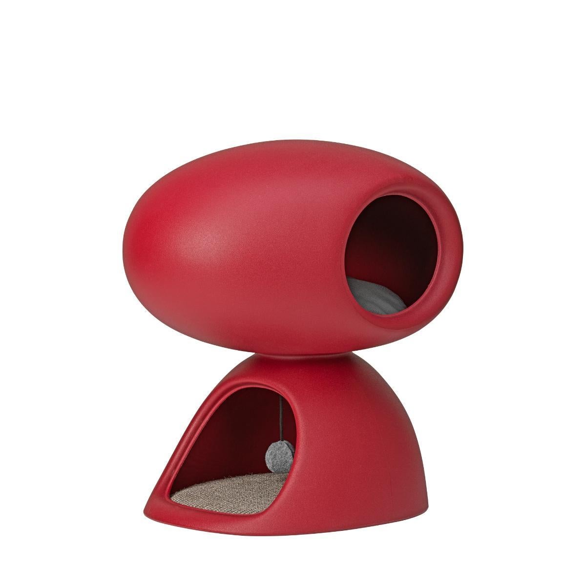 Cat Cave, designed by Stefano Giovannoni as a partnership with United Pets, is a home-cave-refuge for cats. It is composed of two overlapping stones: the bottom cave has a scratching mat on the floor and a soft ball hanging from the ceiling. The top