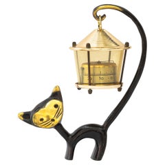 Cat Figurine Holding a Thermometer by Walter Bosse