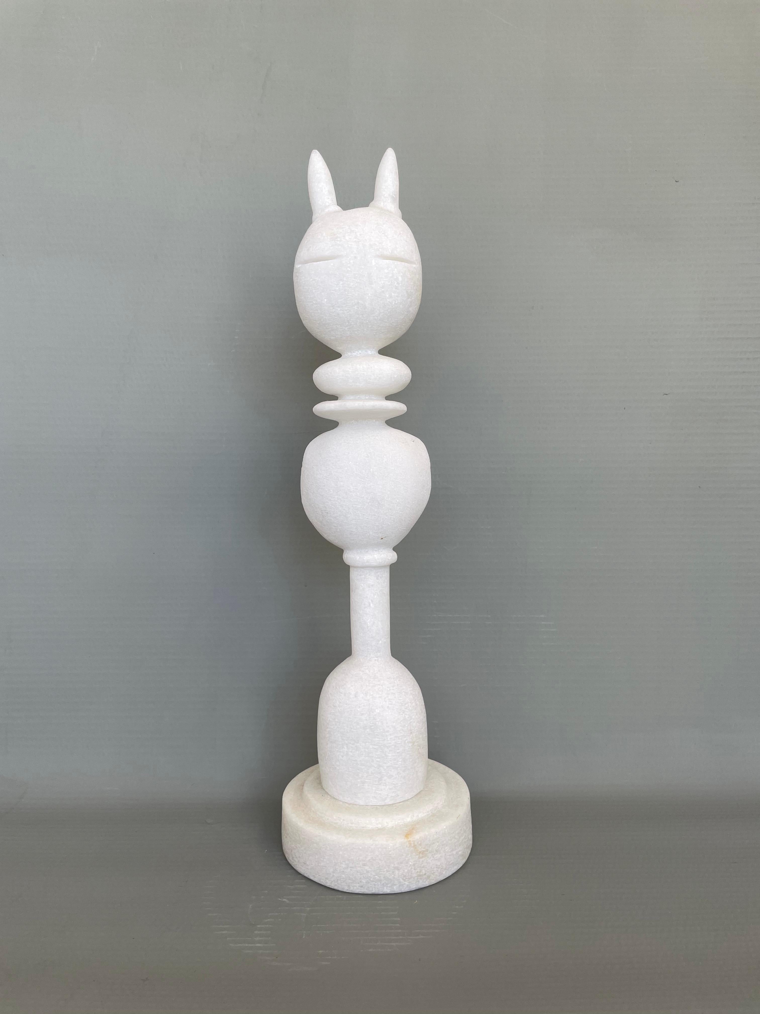 Cat King marble sculpture by Tom Von Kaenel
Dimensions: D15 x H53 cm
Materials: Marble

Tom von Kaenel, sculptor and painter, was born in Switzerland in 1961. Already in his early
childhood he was deeply devoted to art. His desire to bring