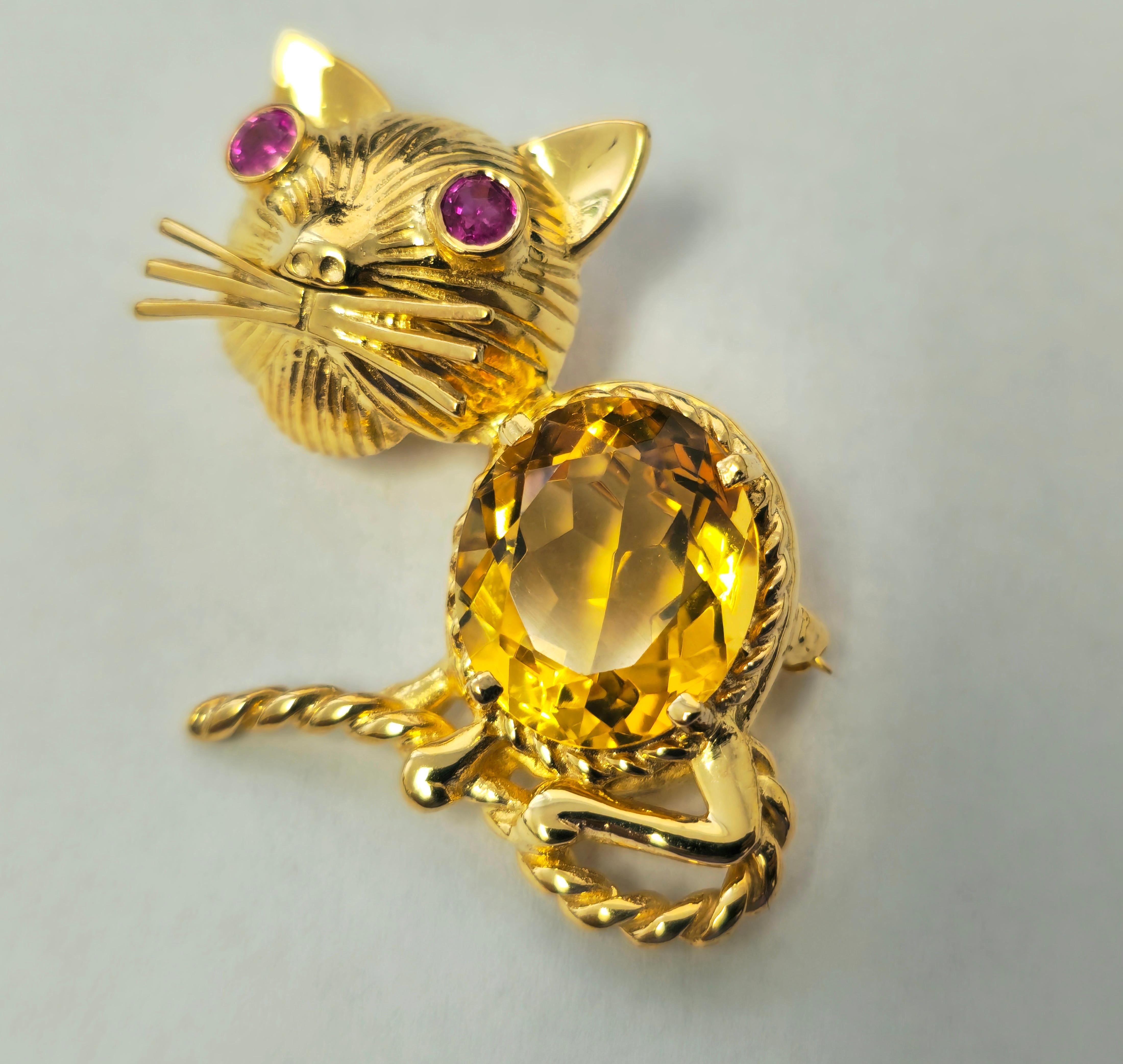 This exquisite vintage pin showcases a captivating 8.43 carat oval-shaped natural yellow citrine, complemented by a delicate 0.19 carat round ruby, all set in lustrous 14k yellow gold. With a weight of 11.30 grams and dimensions of 1.30 inches, this