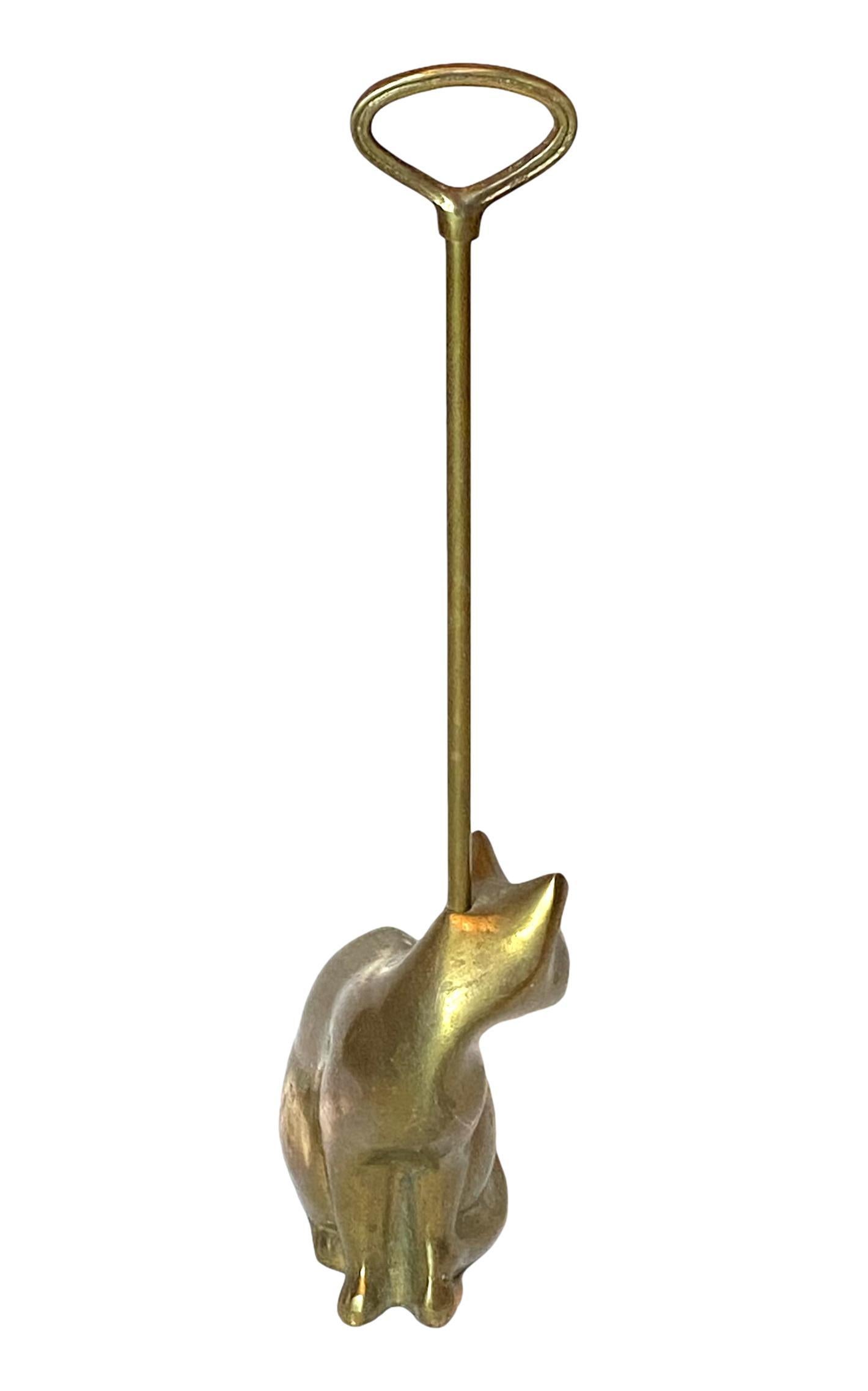 A beautiful and substantial Art Deco style brass cat sculpture door stand measuring totally 19 3/8