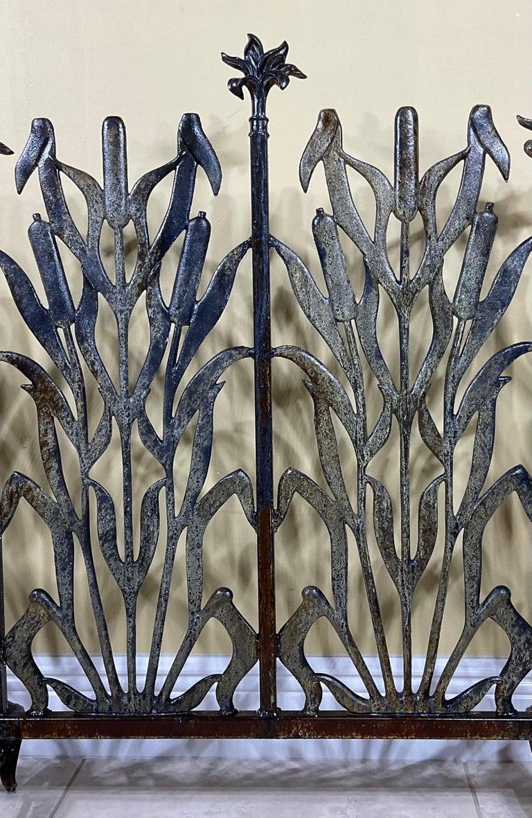 Beautiful fireplace screen made of cast iron, with decorative motifs of cat tail and flowers. Treated and seal for rust.