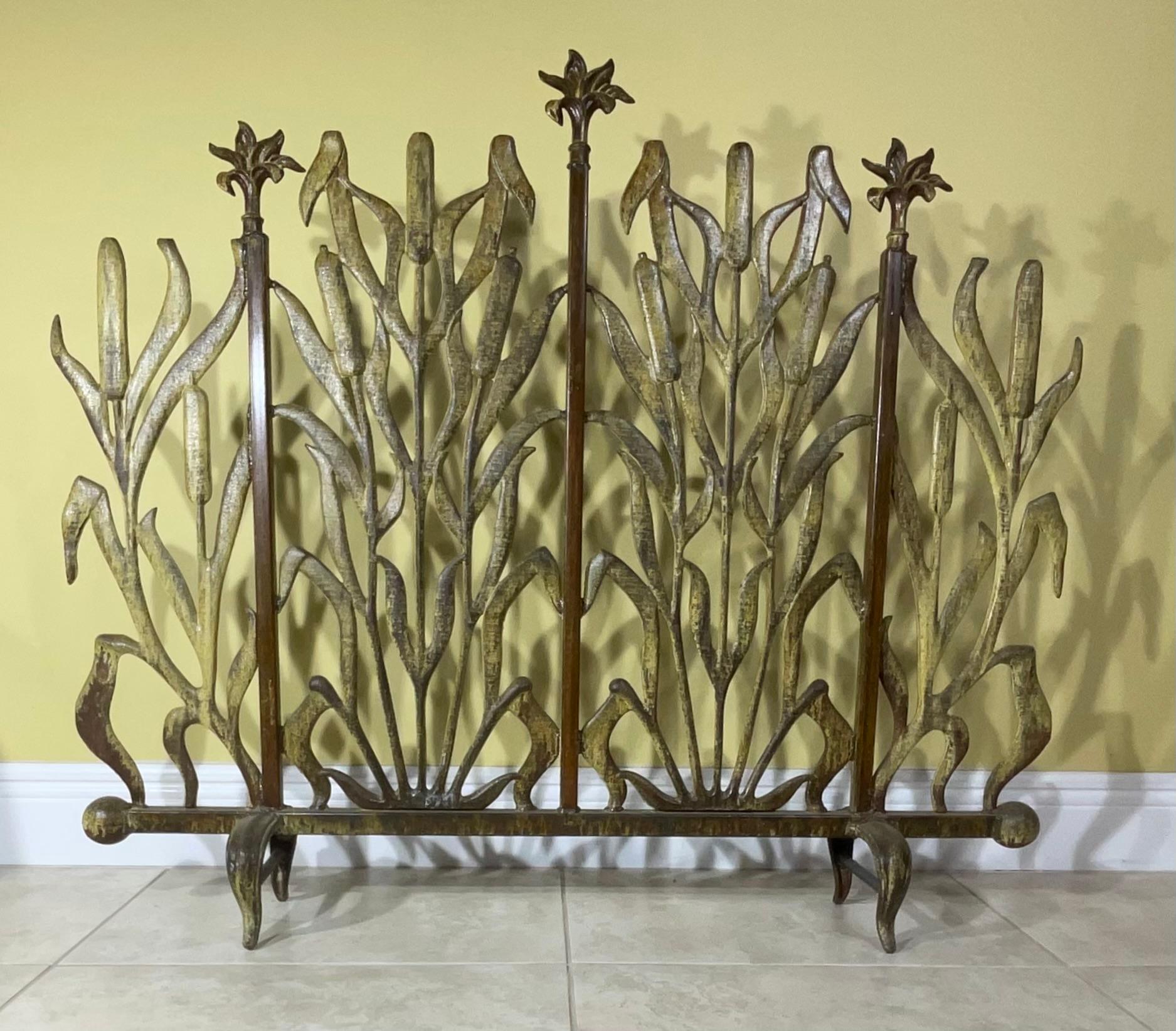 Treated and seal for rust.

This Cat Tail Iron Fireplace Screen is a beautiful and unique decorative piece that adds a touch of rustic elegance to a fireplace. The intricate design features stylized cattails in a warm, earthy color palette, creating