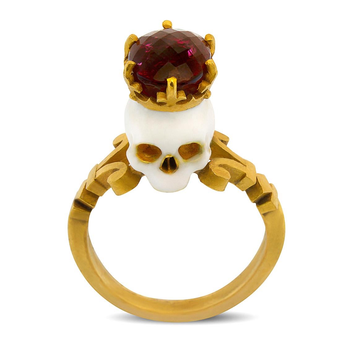 Handcrafted in luxurious 22kt yellow gold this stunning ring features a saintly baroque style enamelled skull adorned with a crown and deific 10mm x 8mm rubellite tourmaline perched atop a signature William Llewellyn Griffiths split shank.