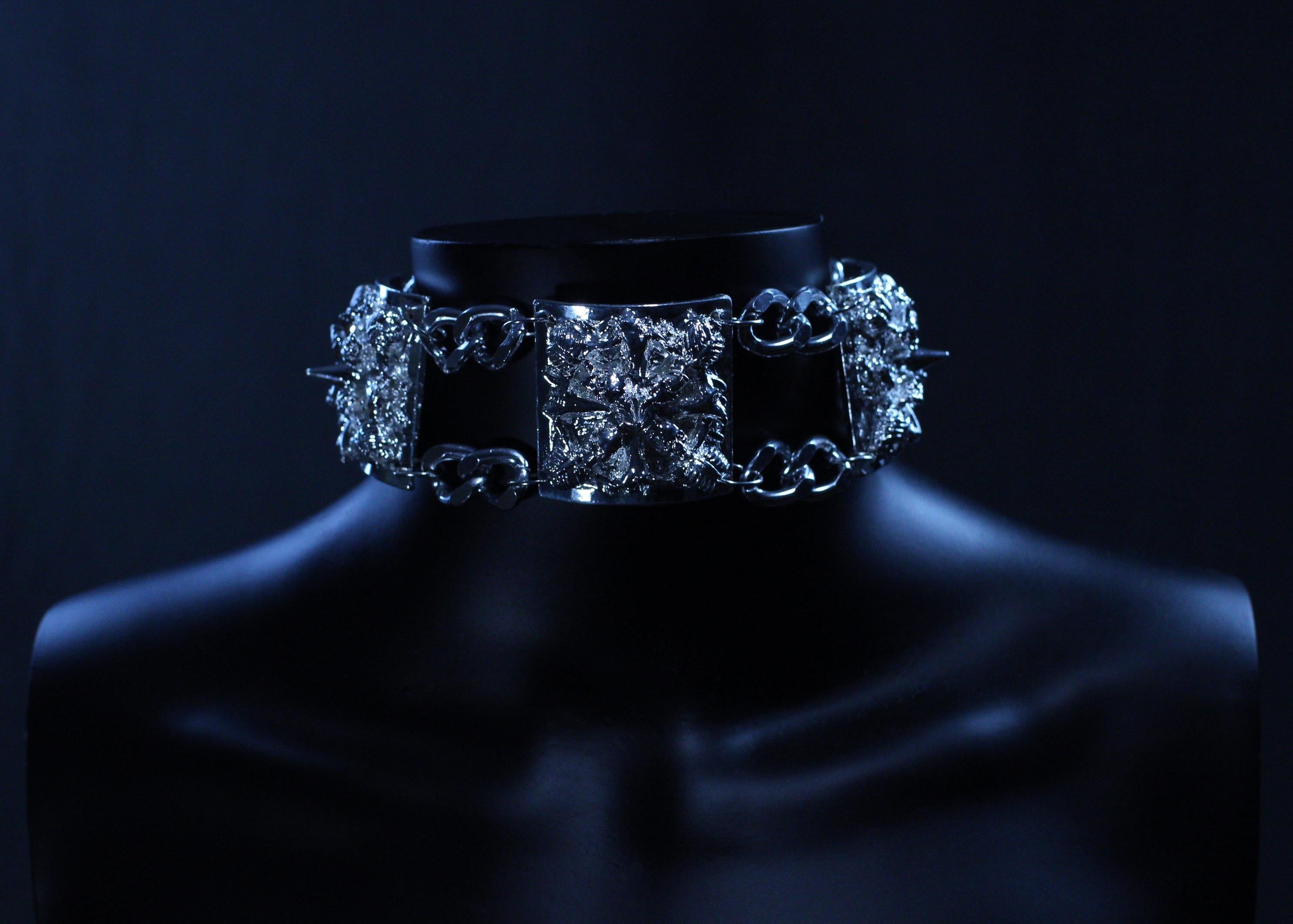 Catacombs Choker

Product details
Hand-sculpted skull choker by designer Angelis Blade, inspired by the haunting beauty of the French catacombs. This striking, three-piece choker embodies the eerie charm of ancient tombs. Each square segment