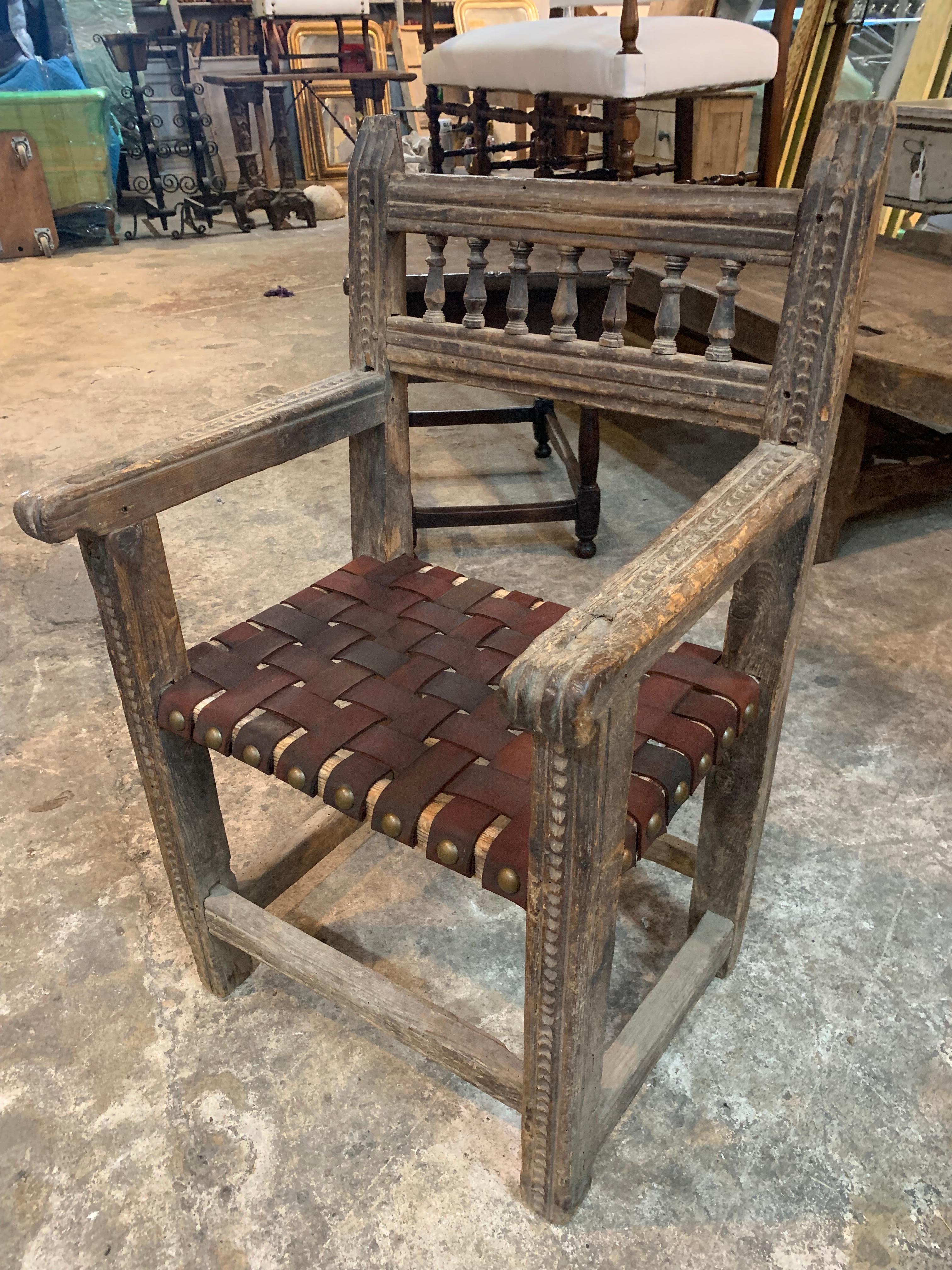 A very handsome 17th century armchair from the Catalan region of Spain. Beautifully and soundly constructed from naturally washed oak and leather strapping with handsome nail head detailing. Wonderful as an accent chair or desk chair.