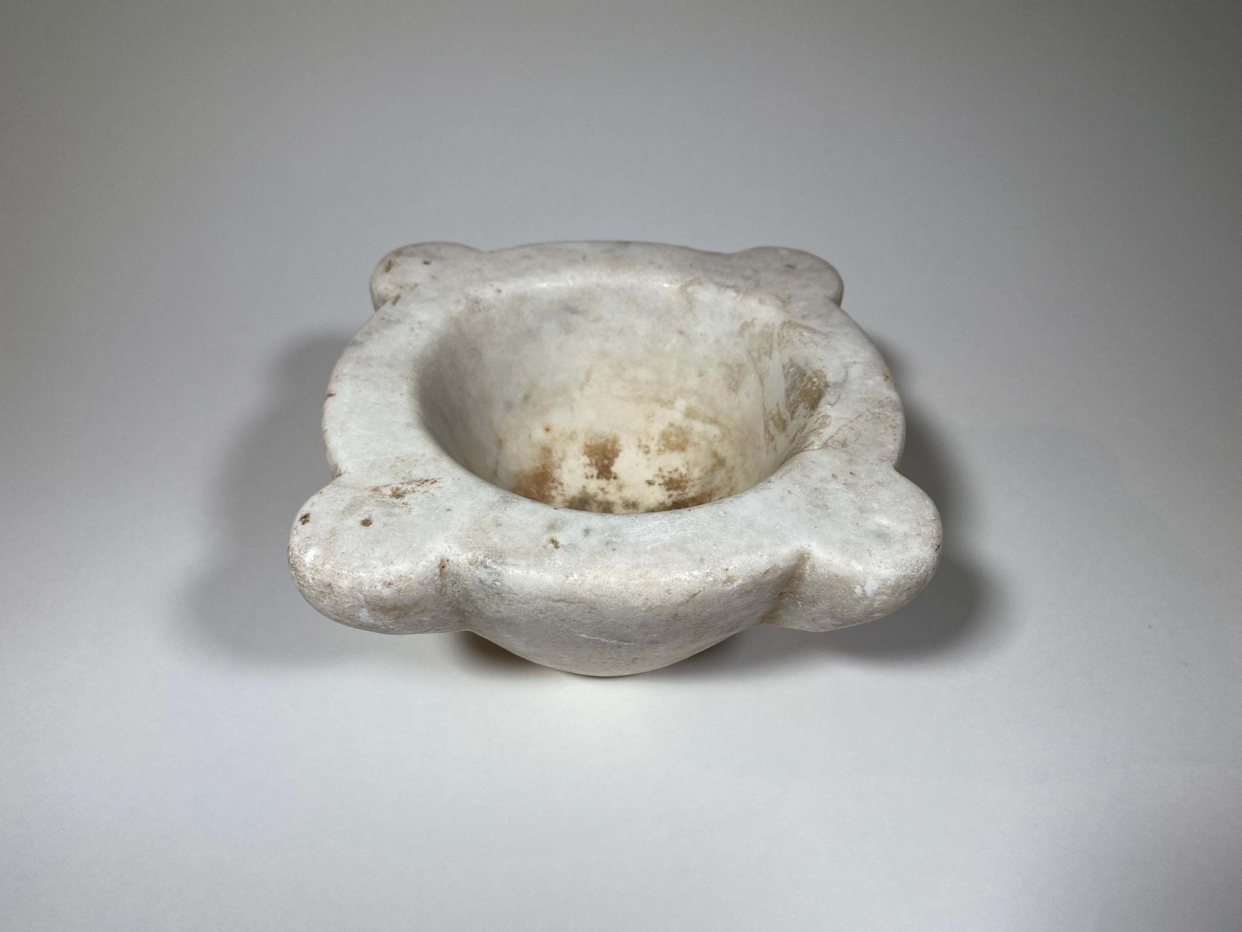 A very charming 18th century mortar from the Catalan region in Spain. Beautifully carved from marble. A wonderful accessory piece for any kitchen, bathroom, or table top.