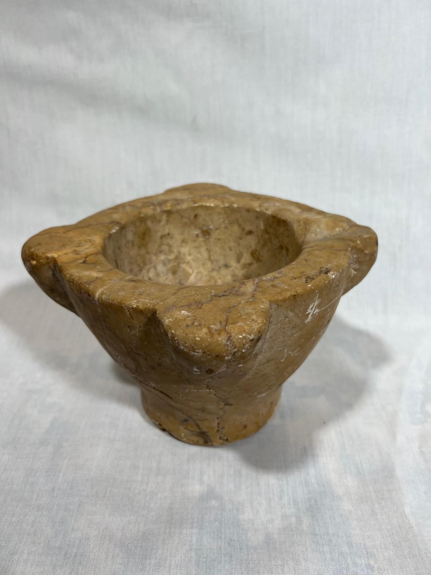A very charming 18th century mortar from the Catalan region in Spain. Beautifully carved from marble. A wonderful accessory piece for any kitchen, bathroom, or table top. Beautiful patina.