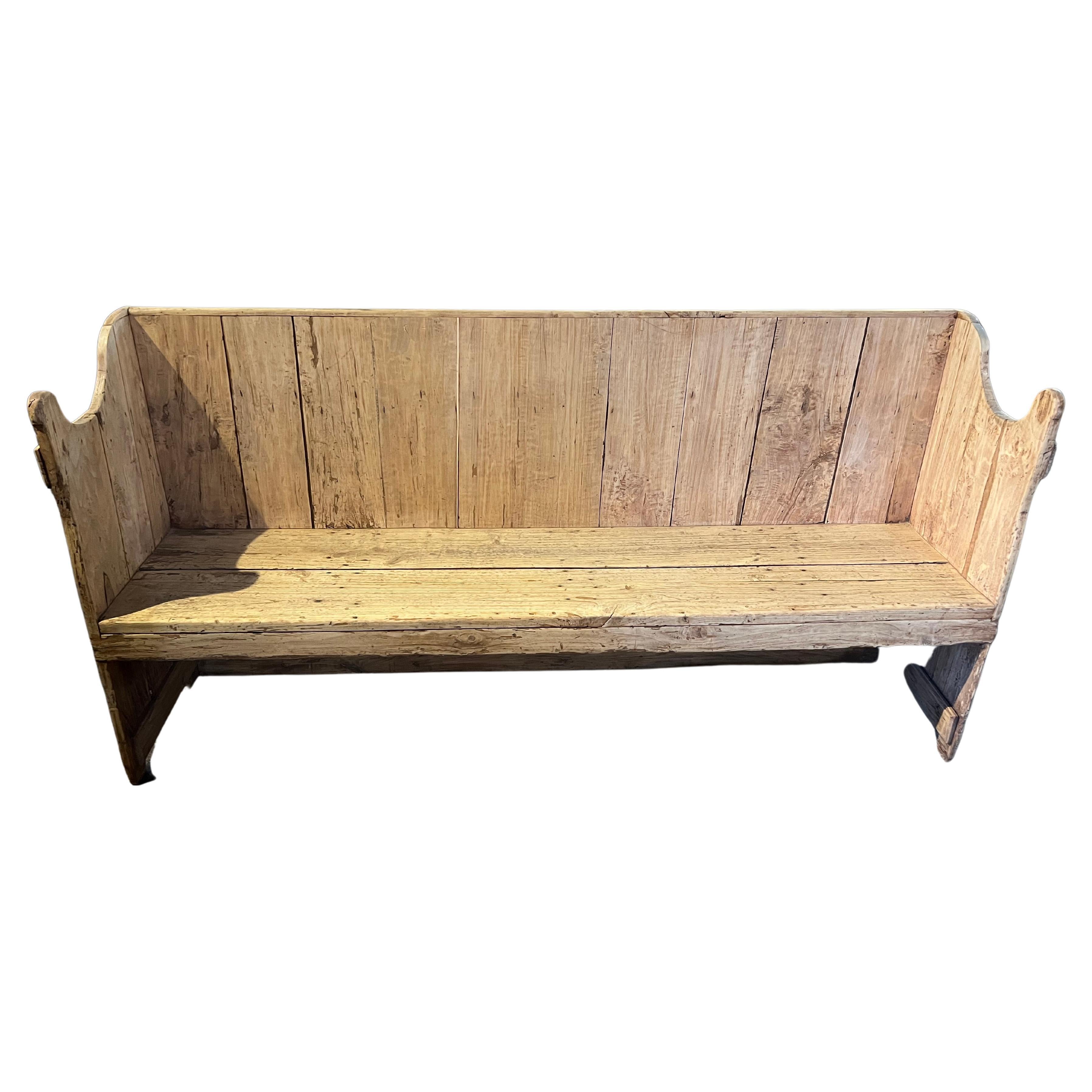 A very handsome early 19th century bench from the Catalan region of Spain. Soundly constructed from washed pine. Wonderful Minimalist lines. The seat height is 18
