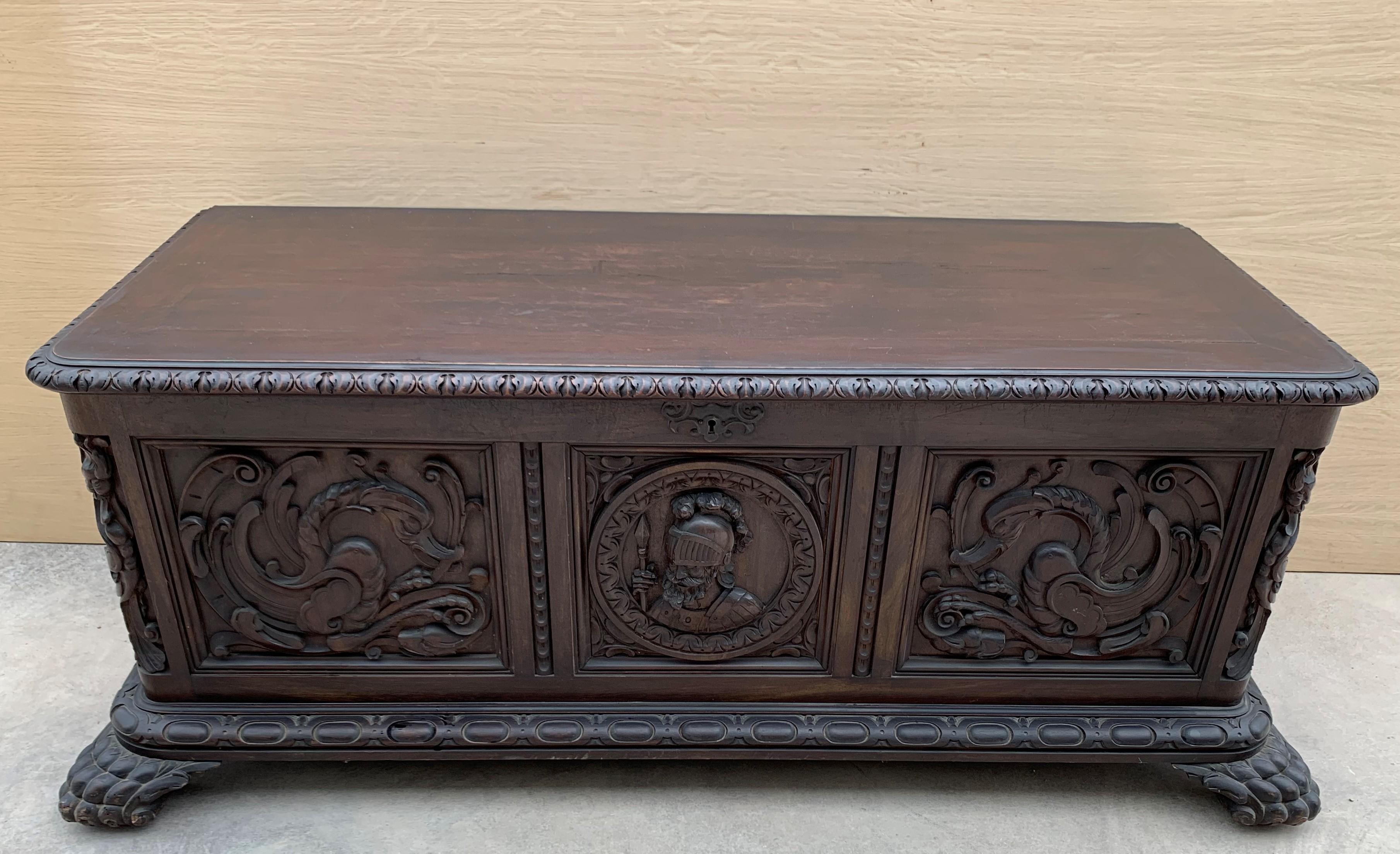 19th century walnut carved cassone with front lion feet.