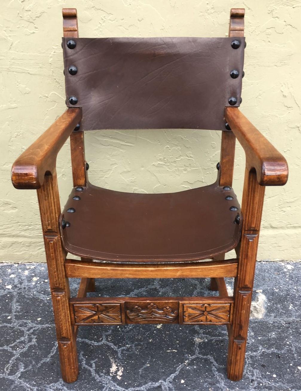 Renaissance style armchair from the Catalan region of Spain. Constructed from richly stained oak and leather, accented with wonderful nailheads.