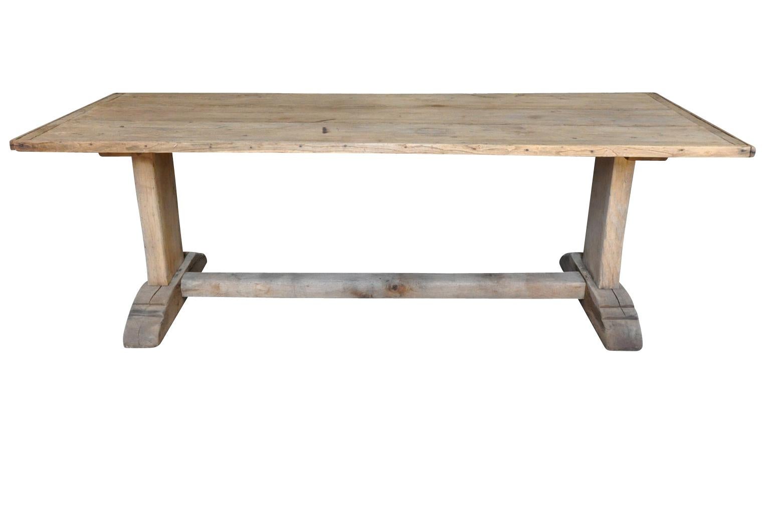 A very handsome farm table, trestle table from the Catalan region of Spain. Wonderfully and very soundly constructed from naturally washed oak with terrific minimalist design. Great patina.