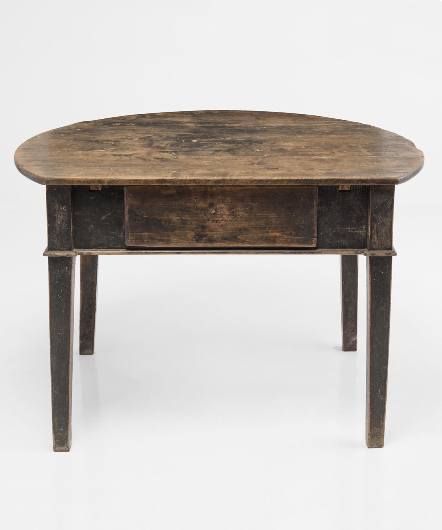 Catalan prep table made in 19th century Spain.

Unique table with two leaves that transforms the piece from circular to rectangular in shape. Removing one of the leaves reveals a single drawer on the base.

Walnut top with amazing patina, and