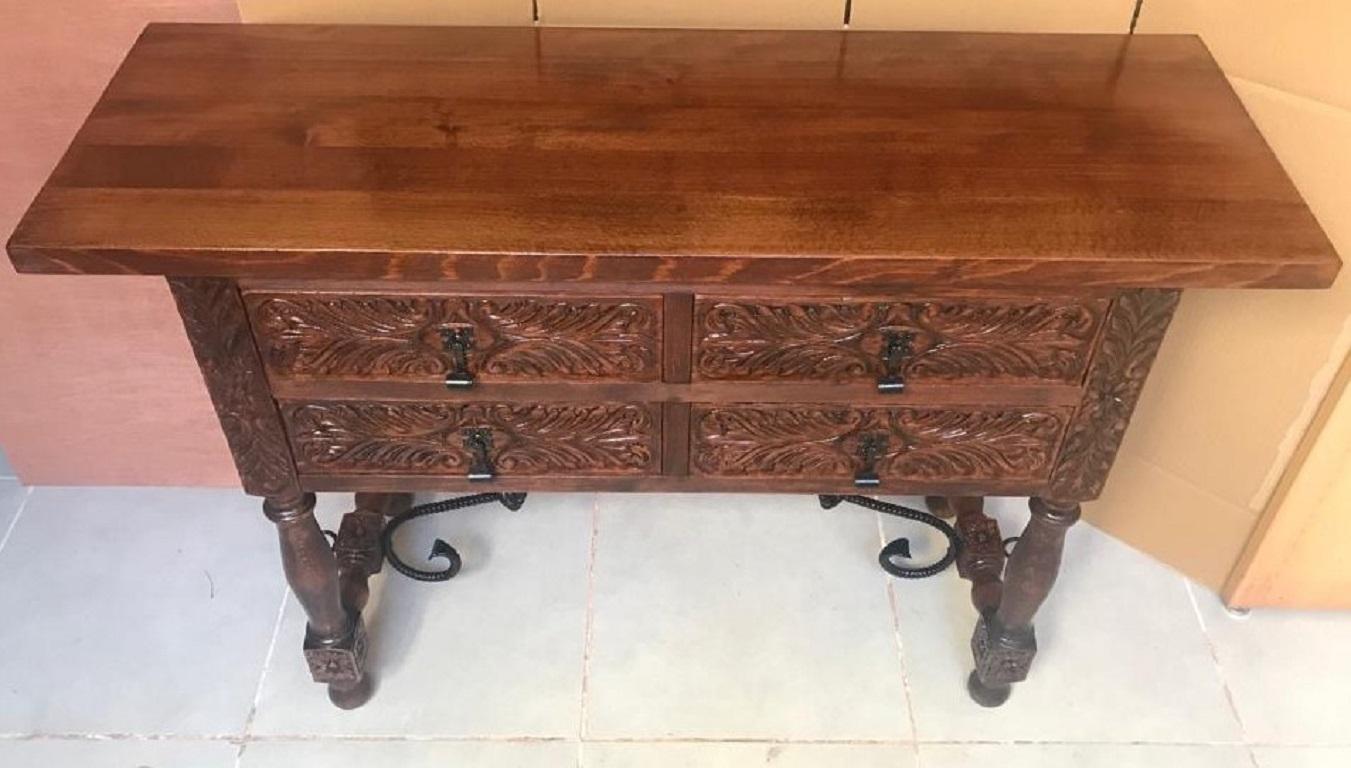 20th century Spanish carved walnut console sofa table with four drawers and iron stretcher
You can use like a commode or chest of drawers
This elegant antique walnut console was crafted in Spain, circa 1900. The sofa table with four legs and