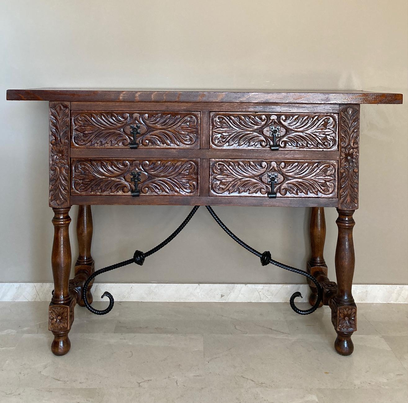 20th century Spanish carved walnut console sofa table with four drawers and iron stretcher
You can use like a commode or chest of drawers
This elegant antique walnut console was crafted in Spain, circa 1900. The sofa table with four legs and