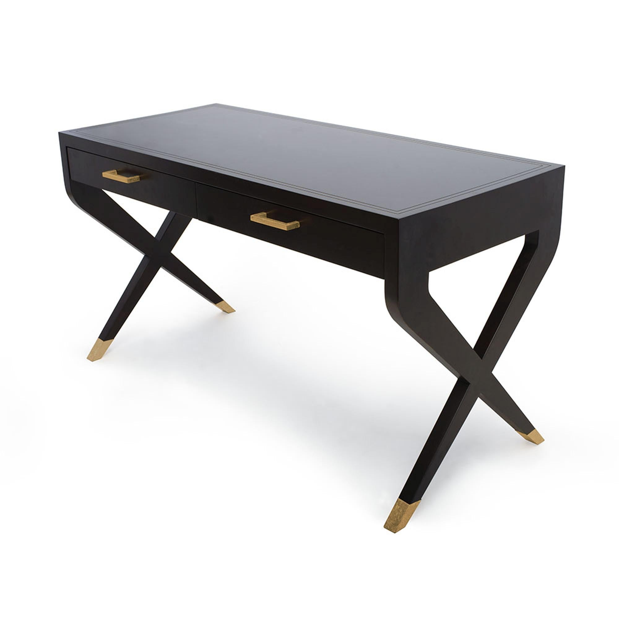 Modern elegance is perfected, with the Catalina desk. Its sleek and chic silhouette adds a sophisticated look to any bedroom or home office. The two legs at each side cross to form an “X”, and are delicately adorned with a metal sabot. Supported by