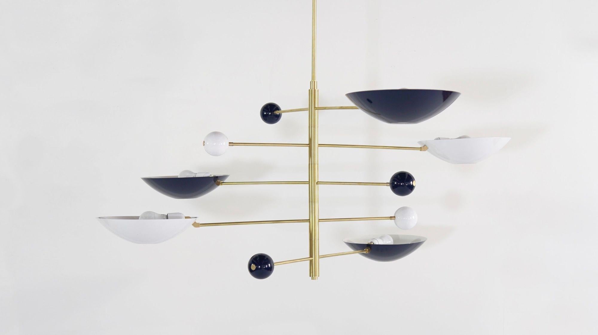 The Catalonia is a commanding statement piece, with design elements of both Italian and French modernism. The height, drop rod, number of tiers, and wing span can be adjusted to suit any room.


Shown in brass and 