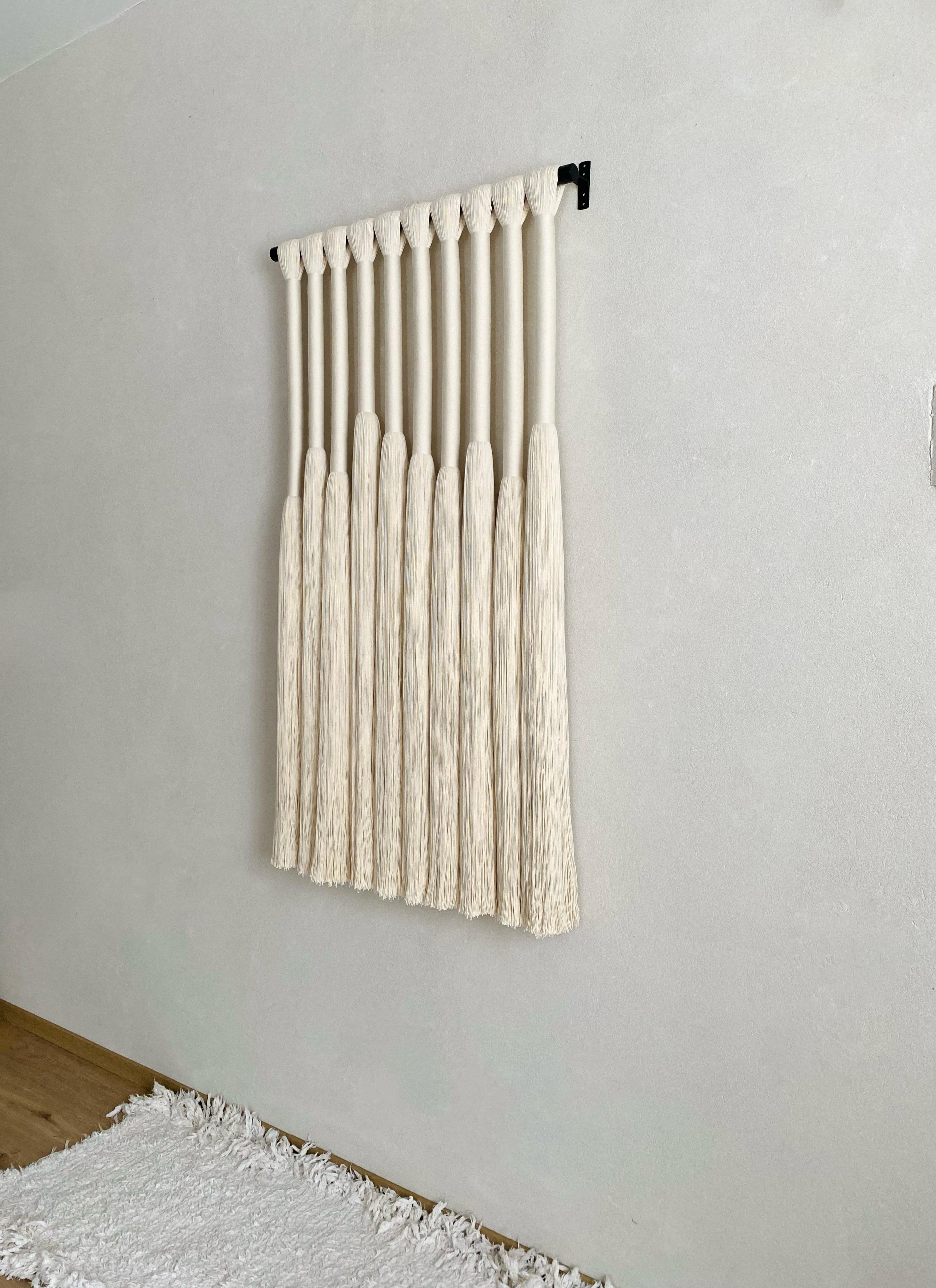 This dramatic wall hanging is an impressive statement piece for almost any room.Custom sizes and others colors available by request.
Each piece is completely made to order and is available to ship 8-9 weeks after ordering. 

Handmade by weavers