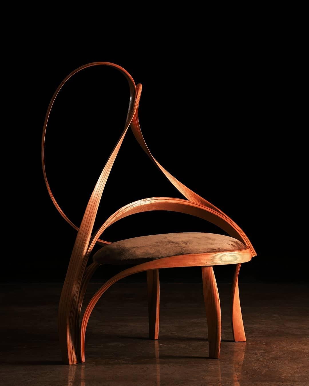 Cataract II a side/filler chair made in solid ashwood by bending wood. Three of the legs have been made using the wood-bending technique to adopt an abstract natural wave-like design. It has been upholstered in a natural Sand coloured velvet. The