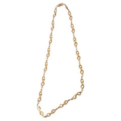Cadena de segmentos de oro amarillo satinado de 18 quilates