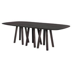 Caterpillar Dining Table Featuring 12 Legs, Blackened Solid Oak.