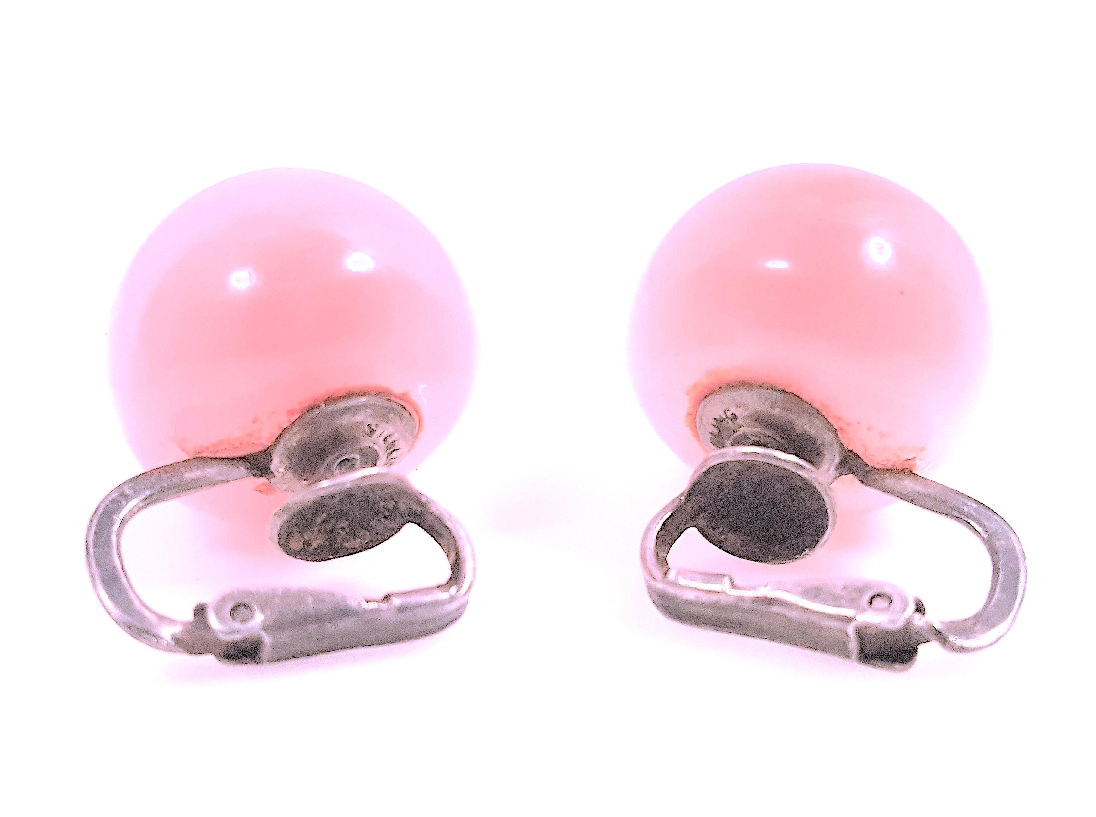 Rare wide cat's-eye, translucent, blue-tone strong pink, near spherical, 14mm moonstones with misty lavender-white schiller are showcased on these antique sterling-silver hinged-clip lever earrings from the early 20th Century. They could be mistaken