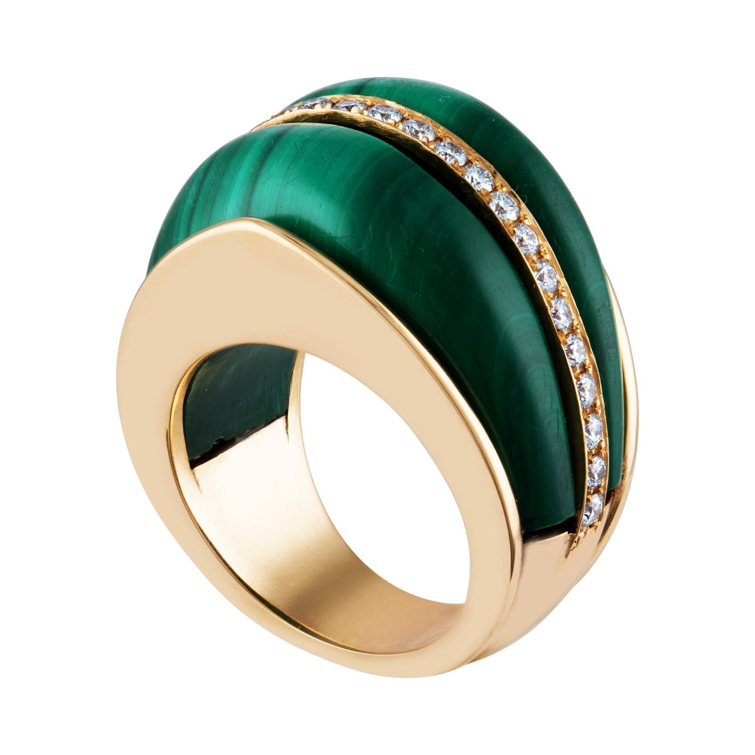 Very Unusual Cathedral Arch Dome Statement Ring
The ring is 14K Yellow Gold
There are 0.56 Carats in Diamonds F/G VS/SI
Beautiful Malachite Dome Stones Flank Diamond Band
The ring is a size 6.50, not sizable
The ring weighs 23.7 grams.