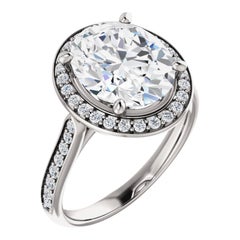 Cathedral Halo Forever One Oval Brilliant Moissanite Diamond Engagement Ring