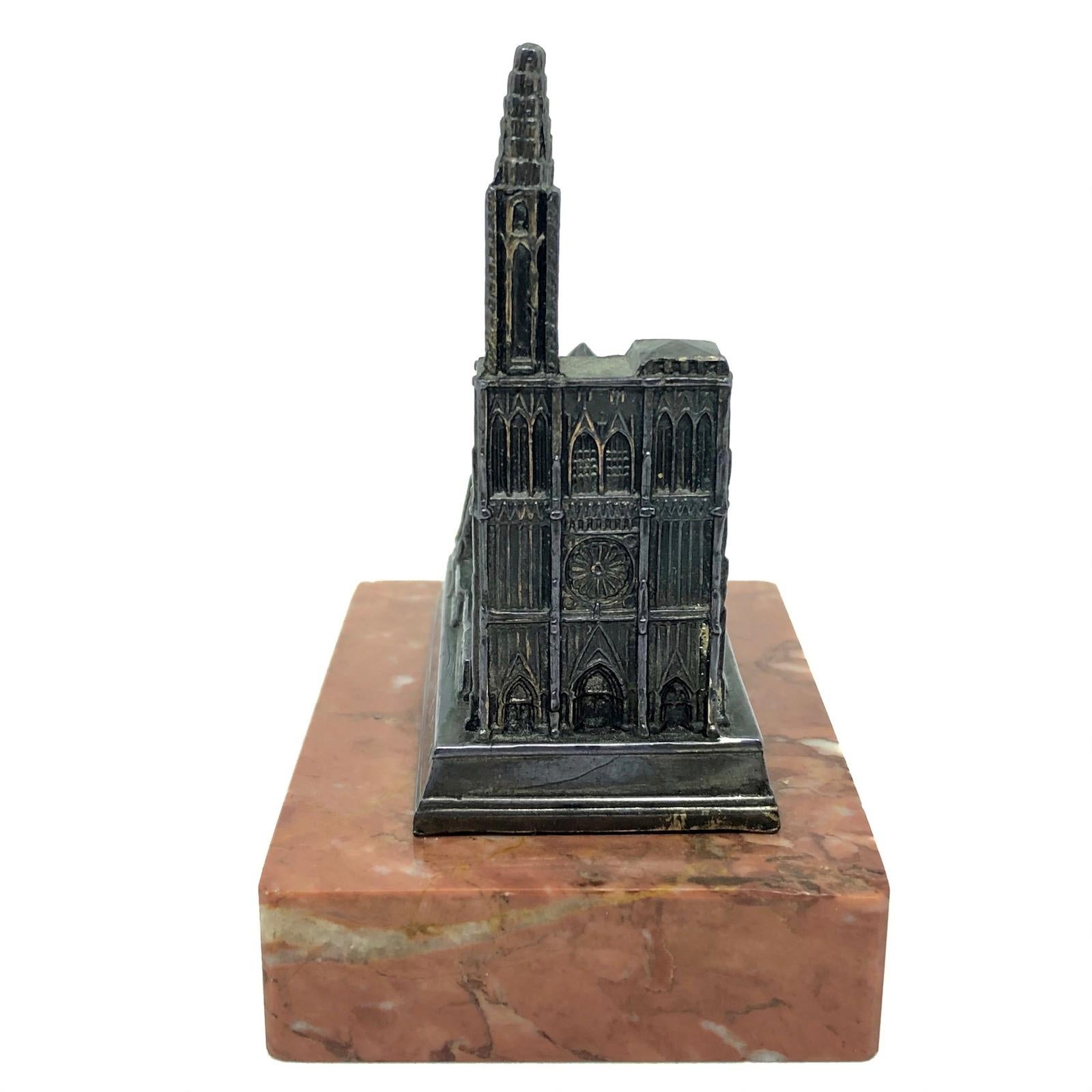 A Cathedral of Strasbourg 1950s Souvenir building architectural model. Some wear with a nice patina, but this is old-age. Made of metal on a marble base. This was bought as a souvenir in France. A beautiful nice desktop item or just a display item