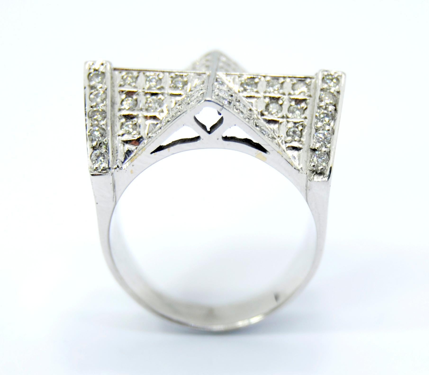 Cathedral Ring in 18 Karat White Gold and Diamonds
These collection is inspired in classicism with architectural mountings  and  vibrant and colorful diamonds.
This ring has total of 0.90ct of round diamonds
Size 16 but can be adjusted
Ring Weight