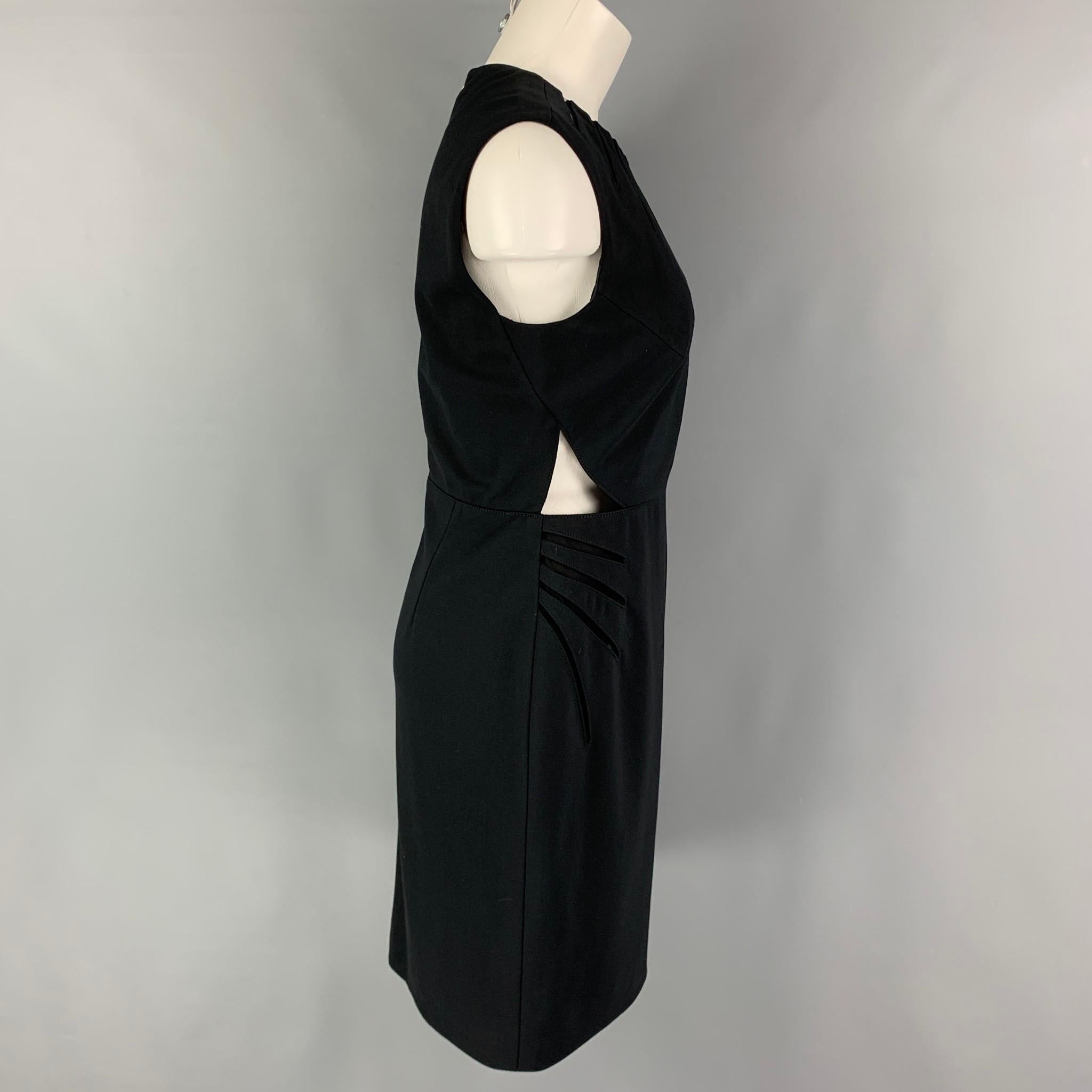 CATHERINE DEANE dress comes in a black rayon blend featuring cut-out designs, mesh panels, and a back zipper closure. 

Very Good Pre-Owned Condition.
Marked: K 12 / US 8 / EUR 40
Original Retail Price: $650.00

Measurements:

Shoulder: 16 in.
Bust: