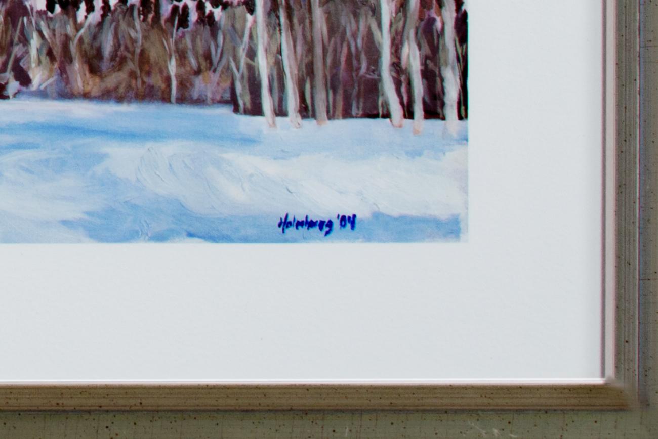 The present object is an original artwork by Catherine Holmburg, made from a giclée print with added hand embellishments. The image presents the viewer with an expansive landscape, showing the Rocky Mountains bright with snow. In the foreground, a