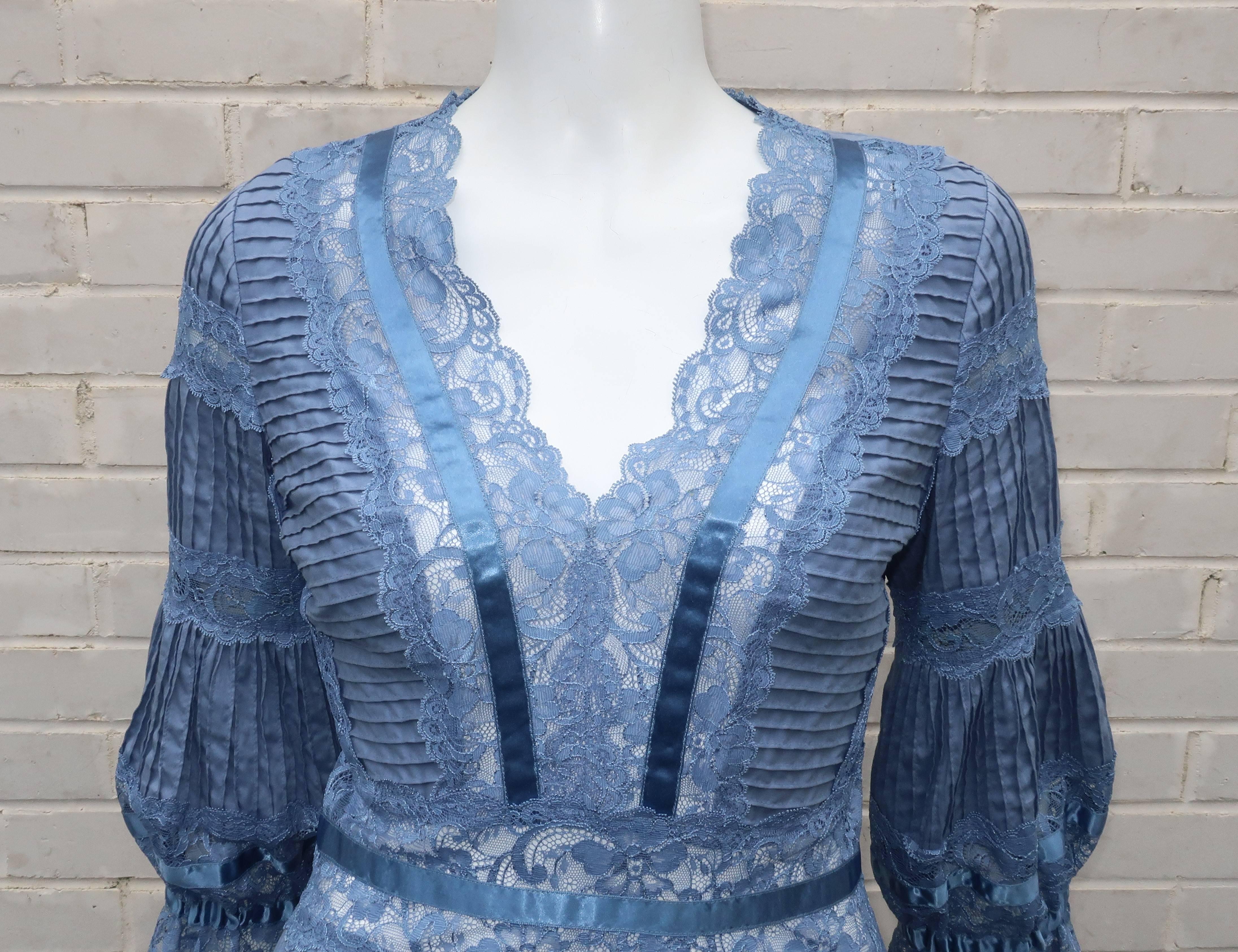 Catherine Malandrino expertly mixes romanticism with feminine silhouettes that are as complimentary to the wearer as to the design.  This pale periwinkle blue cotton top is beautifully detailed with coordinating lace inserts, satin ribbon trim,